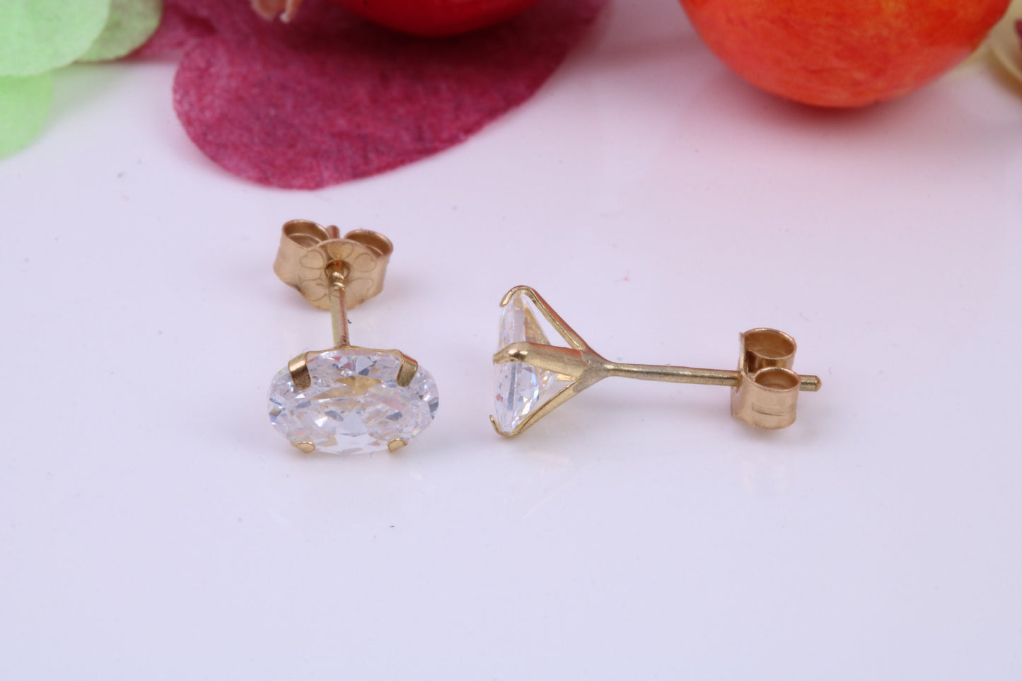 Oval cut Cubic Zirconia set Stud Earrings, Measures 6 x 4 mm, Made from Solid 9ct Yellow Gold