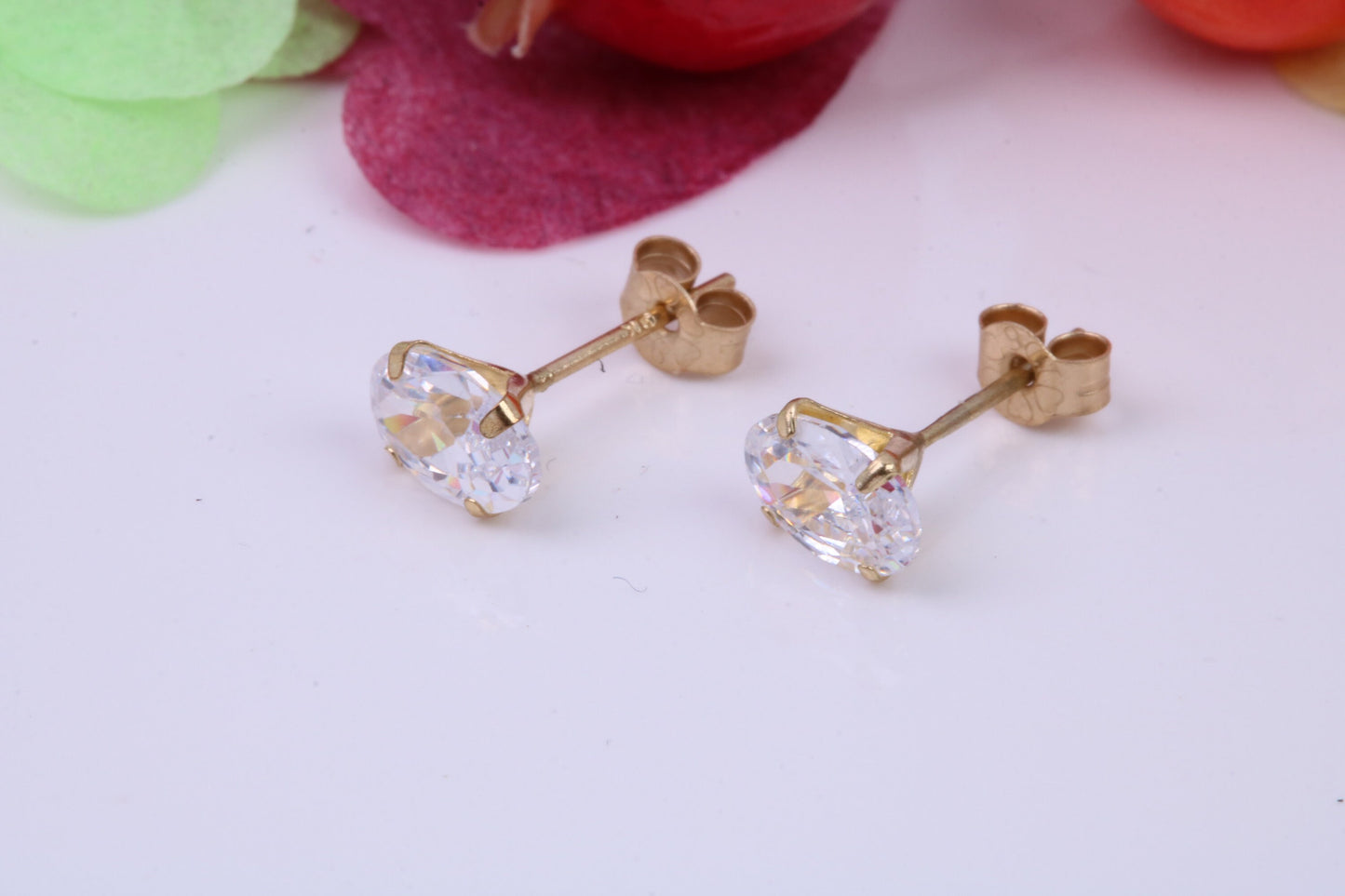 Oval cut Cubic Zirconia set Stud Earrings, Measures 6 x 4 mm, Made from Solid 9ct Yellow Gold