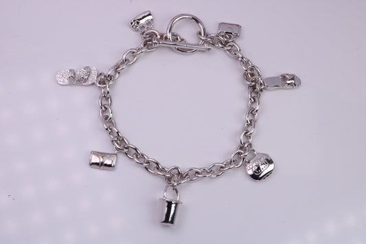Ready to Wear Charms Bracelet, With Seven C Z set Charms Attached, Made from solid Sterling Silver, 7.50 Inches Long, Good Weighty Feel