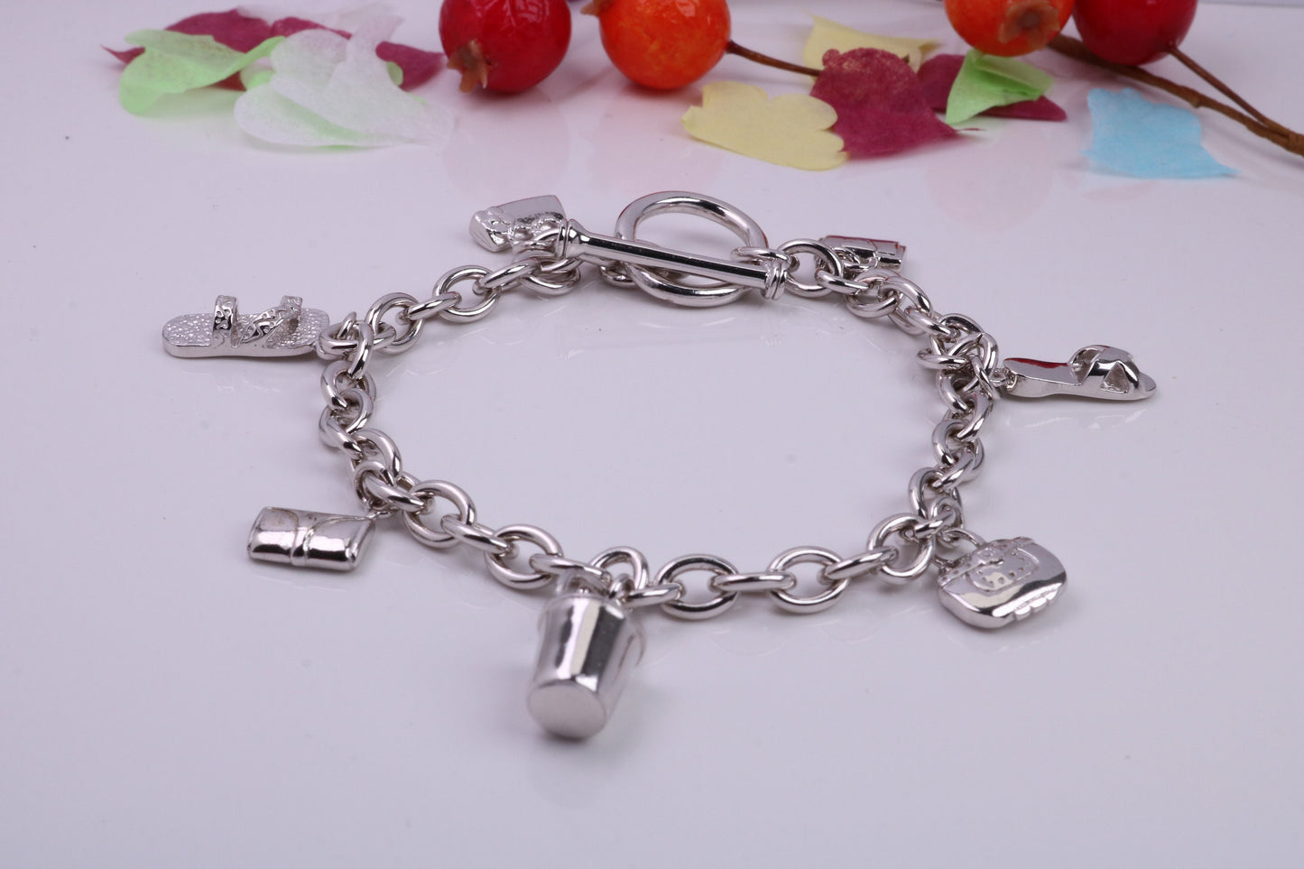 Ready to Wear Charms Bracelet, With Seven C Z set Charms Attached, Made from solid Sterling Silver, 7.50 Inches Long, Good Weighty Feel
