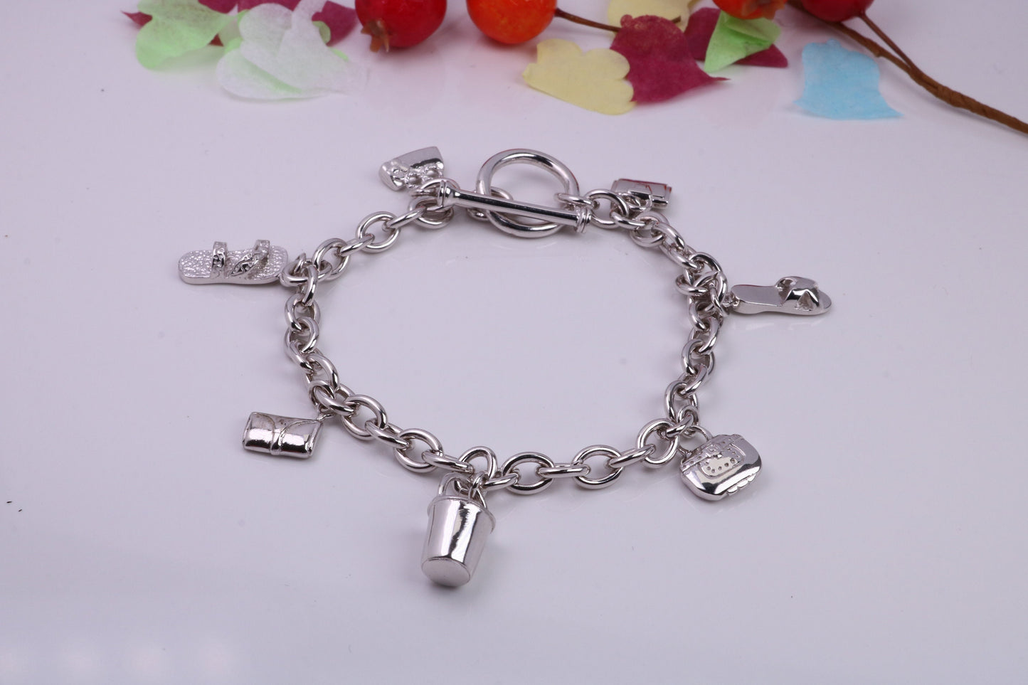 Ready to Wear Charms Bracelet, With Seven C Z set Charms Attached, Made from solid Sterling Silver, 7.50 Inches Long, Good Weighty Feel
