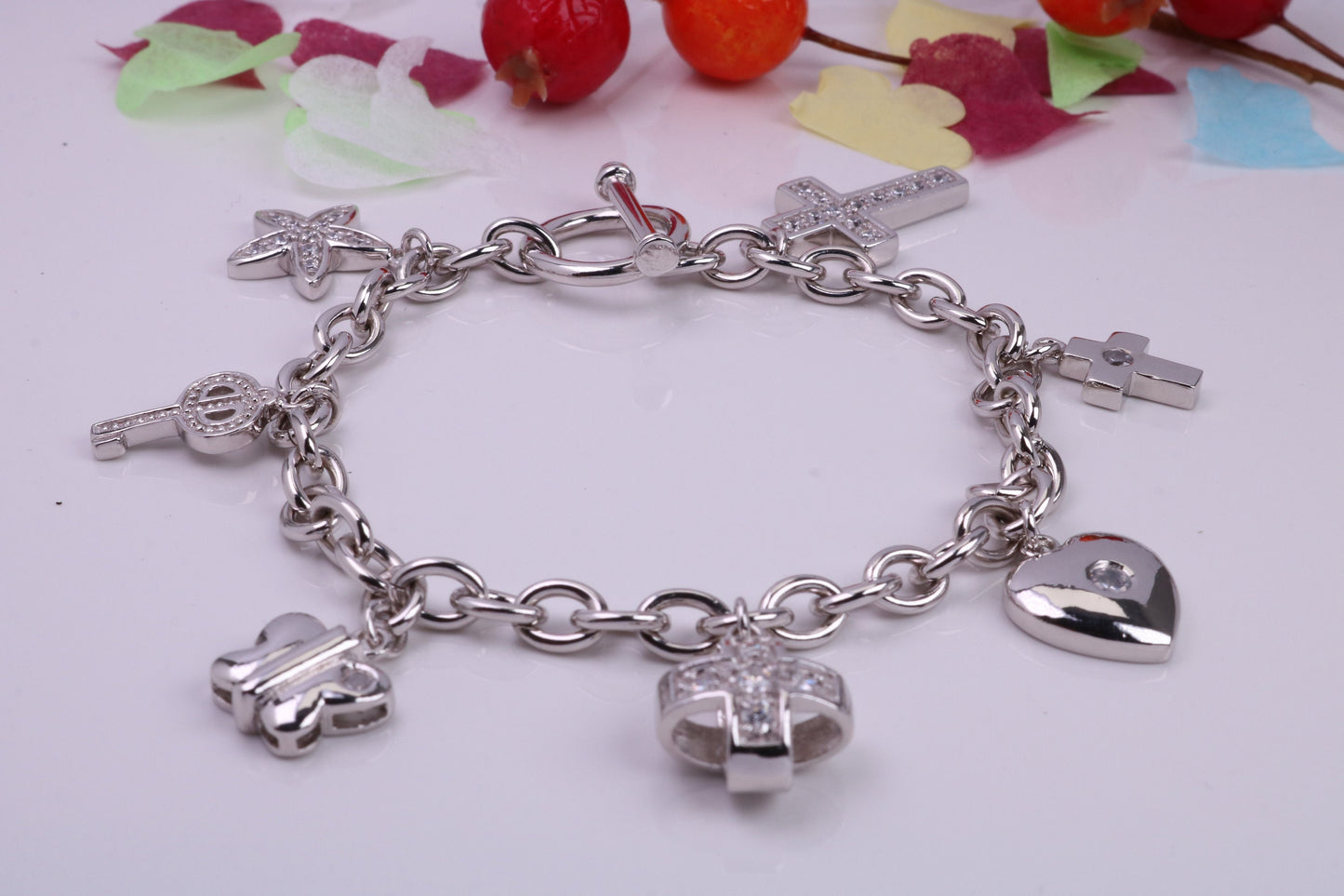 Ready to Wear Charms Bracelet, With seven Charms Attached, Made from solid Sterling Silver, 7.50 Inches Long, Good Weighty Feel