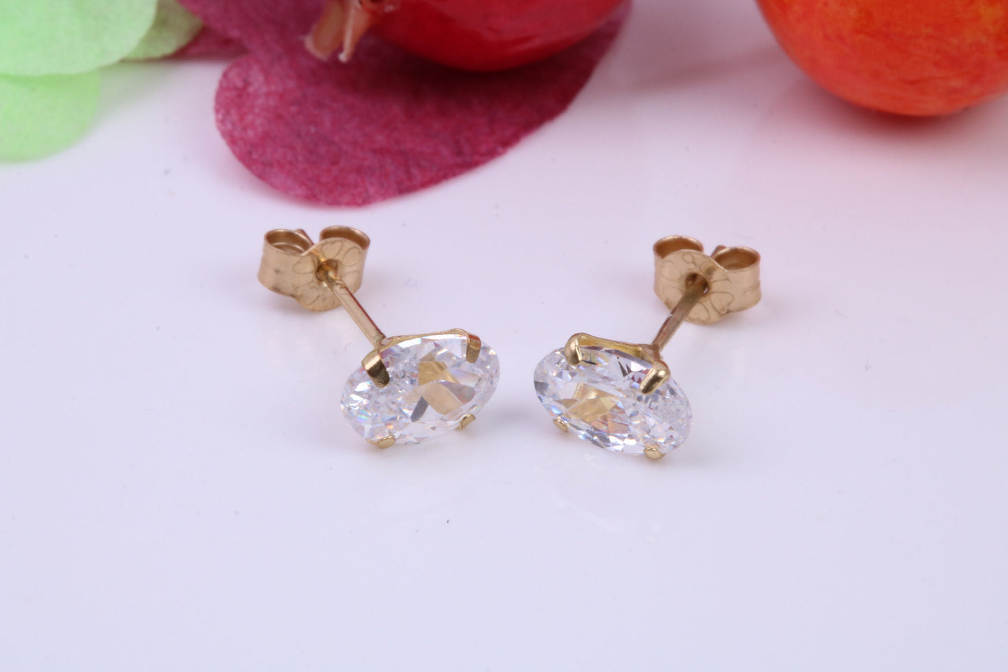 Oval cut Cubic Zirconia set Stud Earrings, Measures 6 x 4 mm, Made from Solid 9ct Yellow Gold