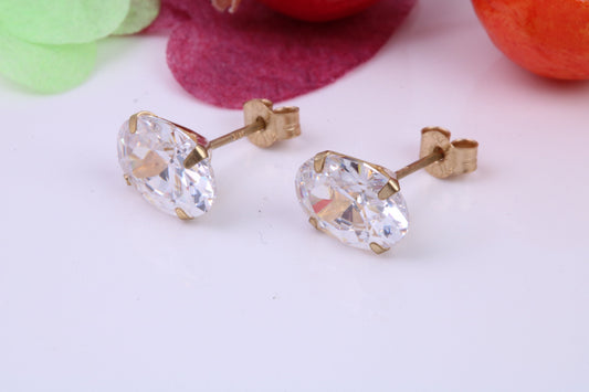 Oval cut Cubic Zirconia set Stud Earrings, Measures 7 x 5 mm, Made from Solid 9ct Yellow Gold