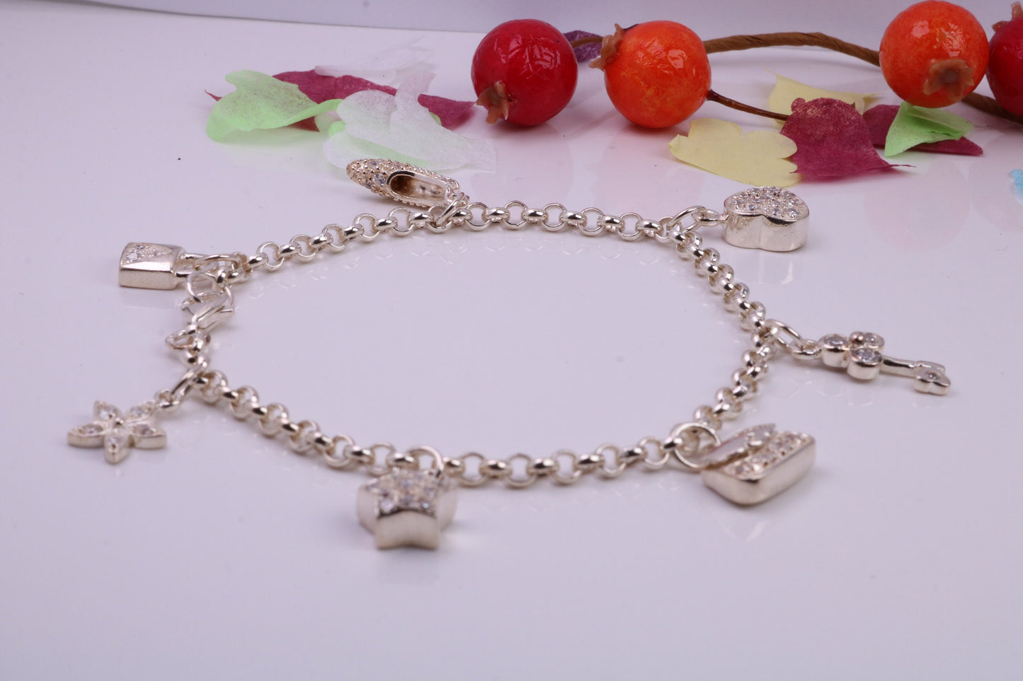 Charms Bracelet, Ready to Wear with Seven C Z set Charms, made from solid Sterling Silver, 7.50 Inches Long