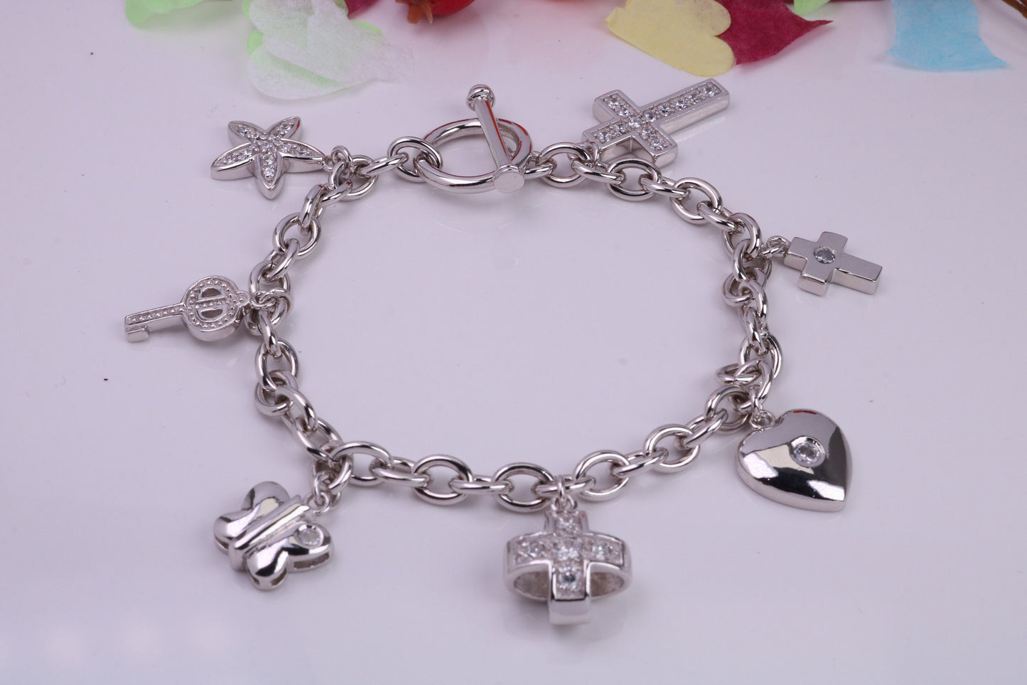 Ready to Wear Charms Bracelet, With seven Charms Attached, Made from solid Sterling Silver, 7.50 Inches Long, Good Weighty Feel