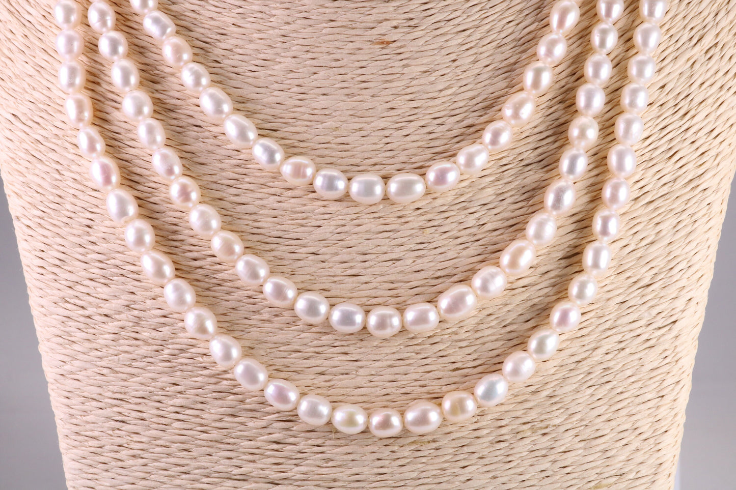Three Strand Natural 7 mm Oval Shaped Pearl Necklace set in Silver, Three Strands Measures 16, 18 and 20 inches Long