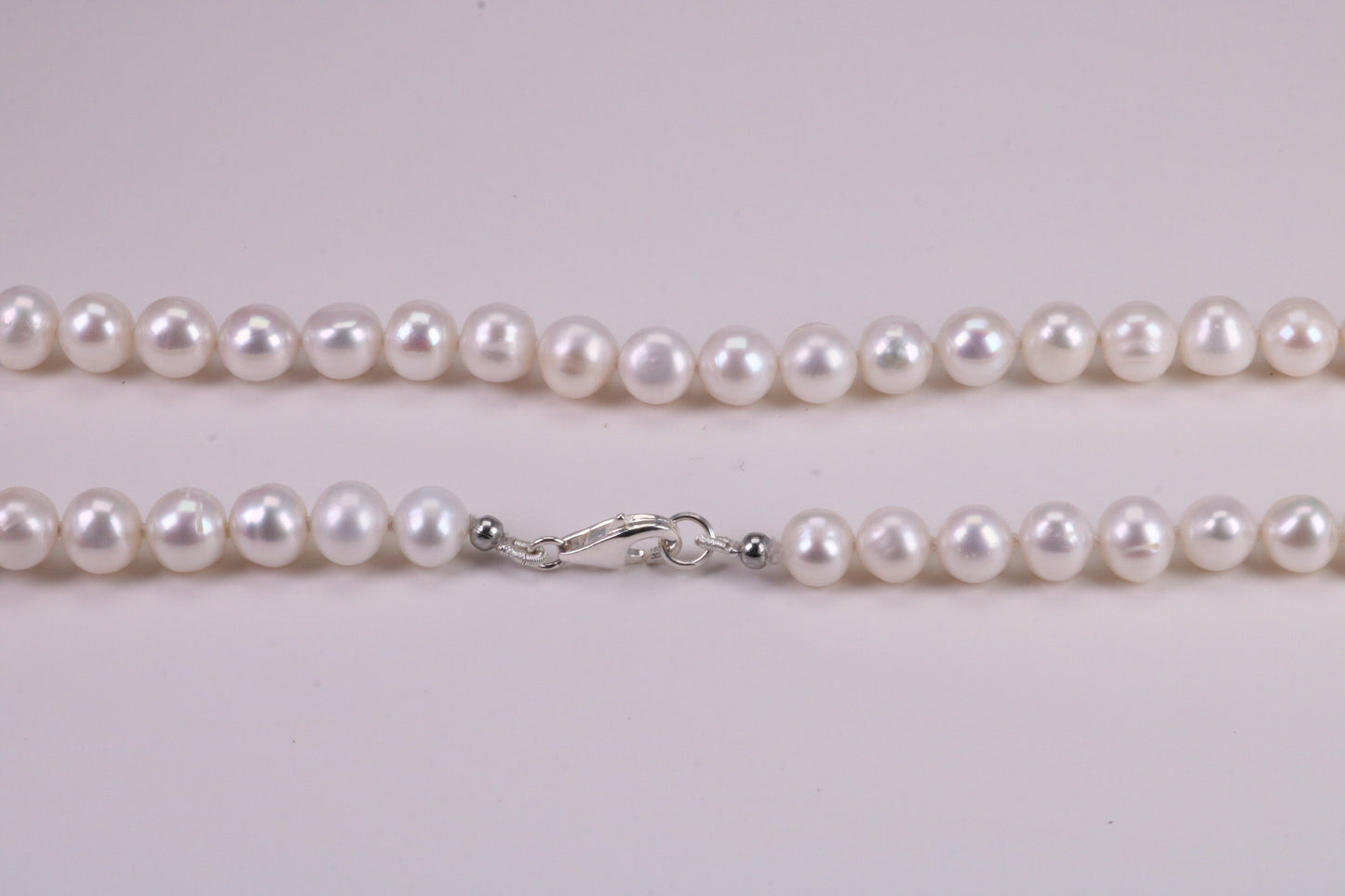 18 Inches Long Single Strand Natural 8 mm Round Pearl Necklace set in Silver