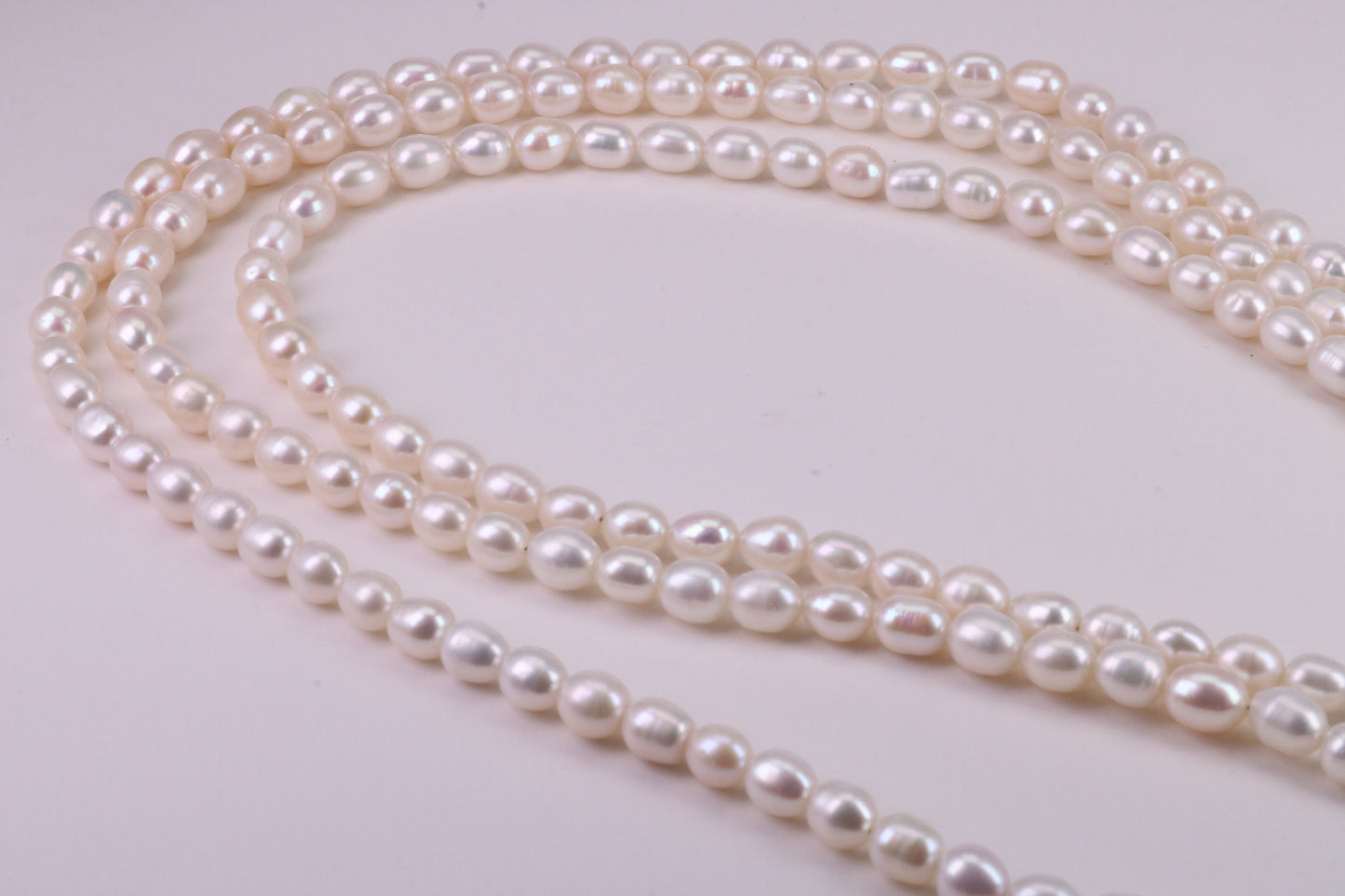 Three Strand Natural 7 mm Oval Shaped Pearl Necklace set in Silver, Three Strands Measures 16, 18 and 20 inches Long
