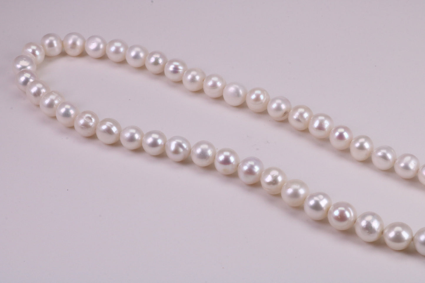 16 Inches Long Single Strand Natural 8 mm Round Pearl Necklace set in Silver
