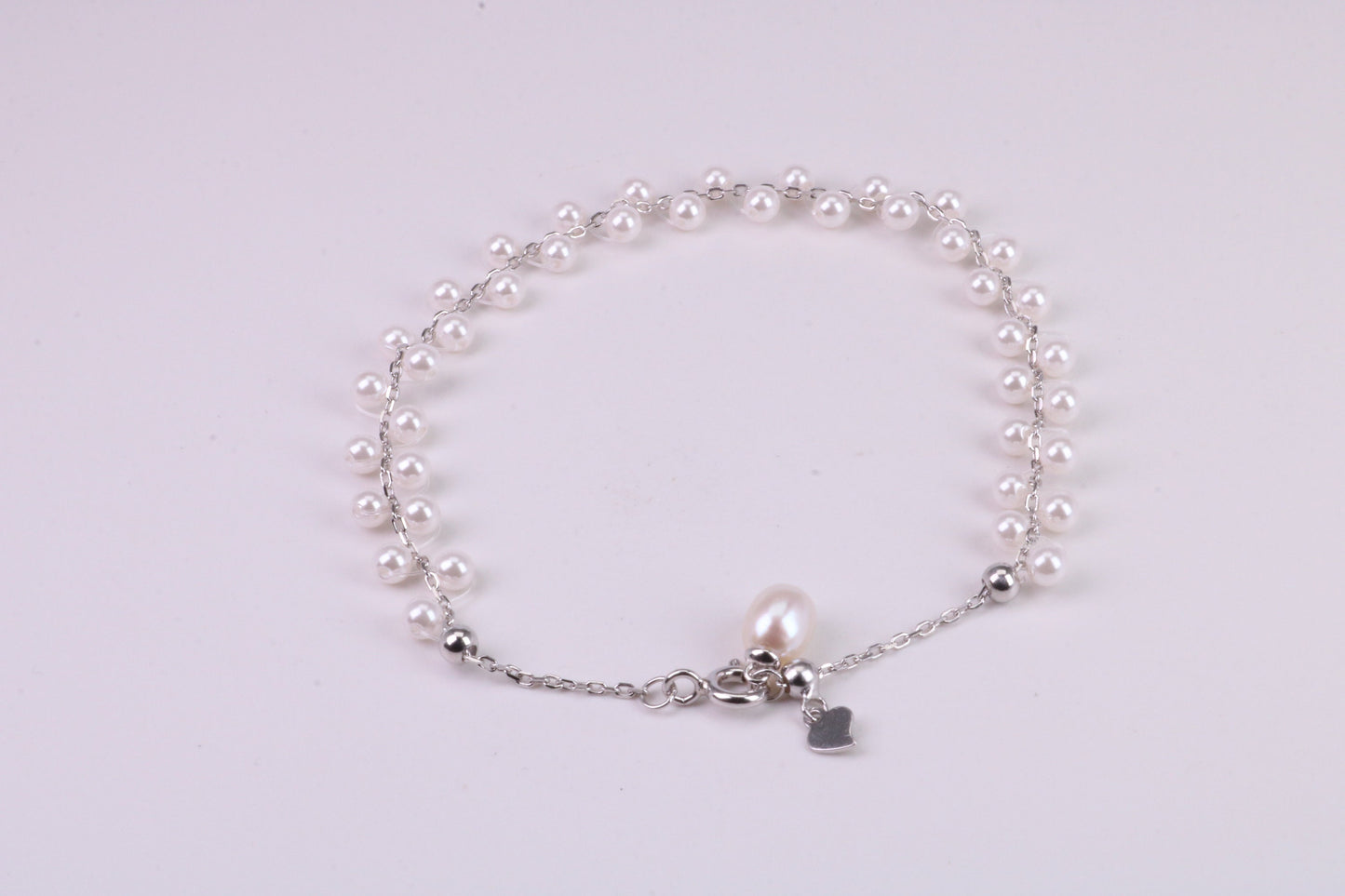 Natural 7.50 inches Long x 7 mm Wide Pearl Bracelet, made from Sterling Silver