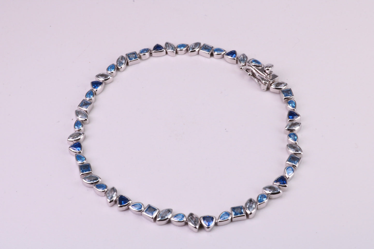 Blue Sapphire, Aquamarine and Topaz C Z Set Bracelet, 7.50 inch Length, Made from solid Sterling Silver