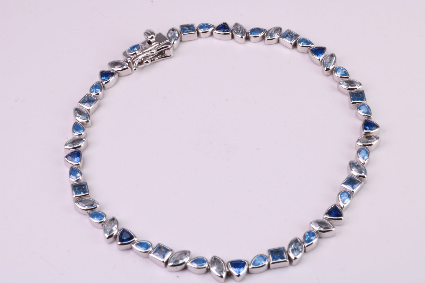 Blue Sapphire, Aquamarine and Topaz C Z Set Bracelet, 7.50 inch Length, Made from solid Sterling Silver