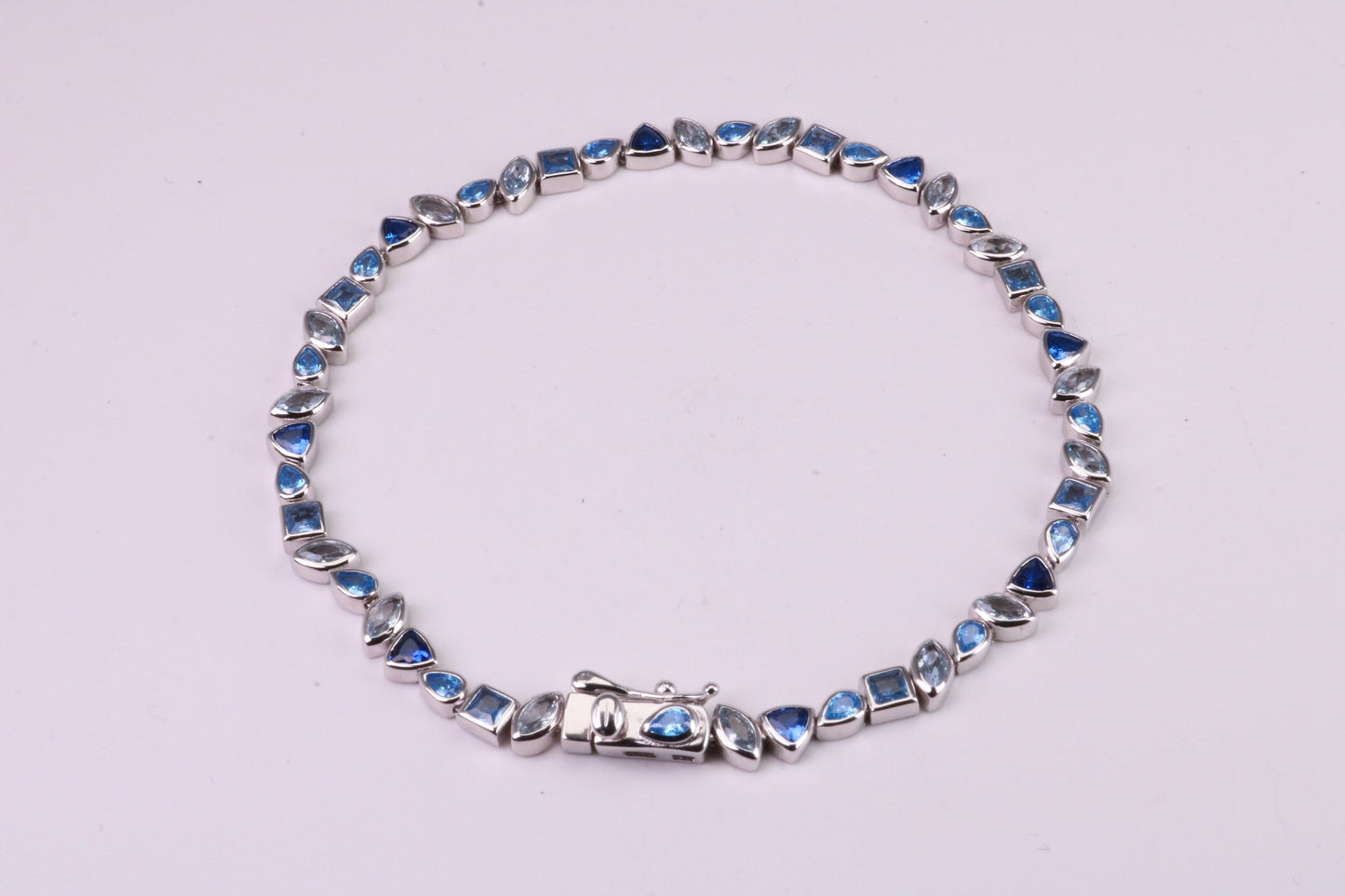 Blue Sapphire, Aquamarine and Topaz C Z Set Bracelet, 7.50 inch Length, Made from solid Sterling Silver