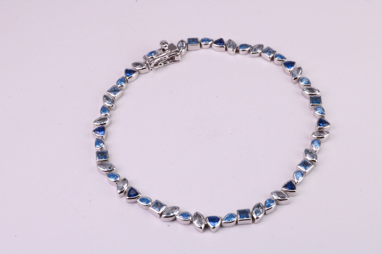 Blue Sapphire, Aquamarine and Topaz C Z Set Bracelet, 7.50 inch Length, Made from solid Sterling Silver