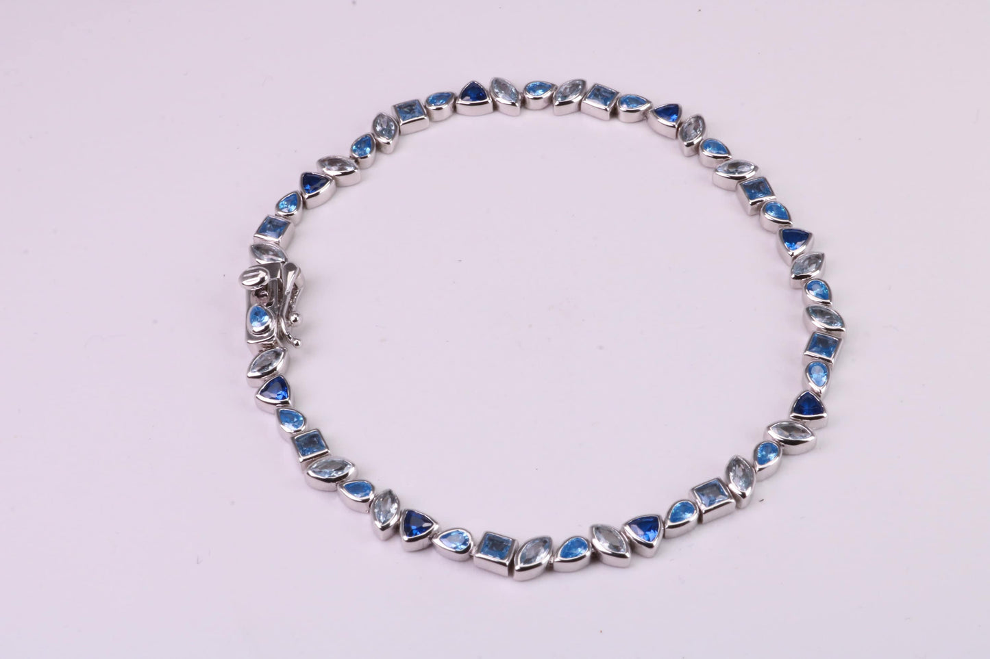 Blue Sapphire, Aquamarine and Topaz C Z Set Bracelet, 7.50 inch Length, Made from solid Sterling Silver