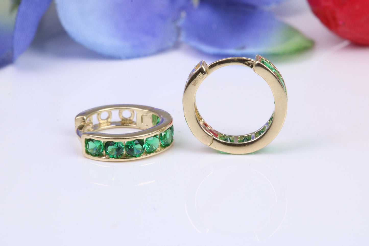 10 mm round hinged hoop earrings, made from solid yellow gold and set with Emerald Green Cubic Zirconia