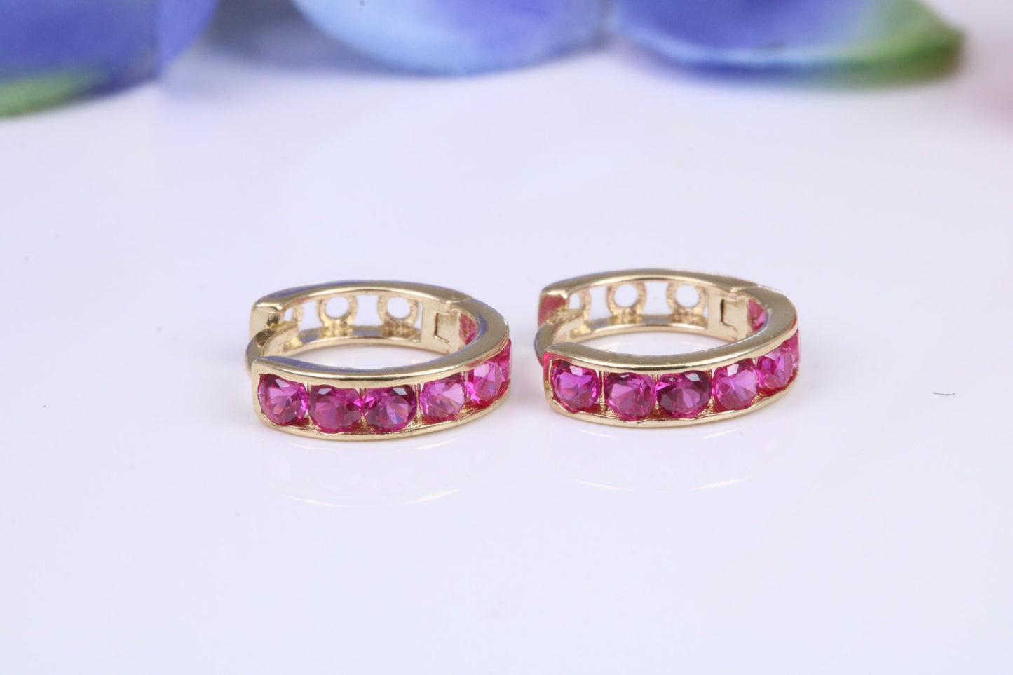 10 mm round hinged hoop earrings, made from solid yellow gold and set with Ruby Red Cubic Zirconia