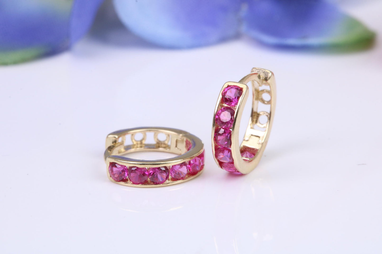 10 mm round hinged hoop earrings, made from solid yellow gold and set with Ruby Red Cubic Zirconia