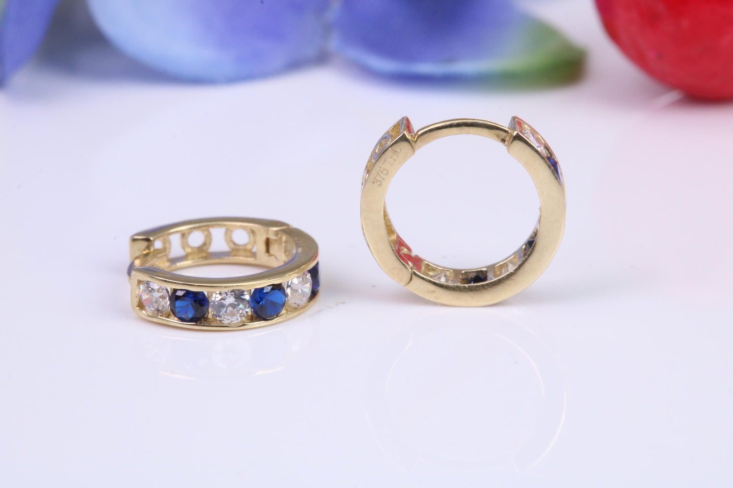 10 mm round hinged hoop earrings, made from solid yellow gold and set with Sapphire and Diamond Cubic Zirconia