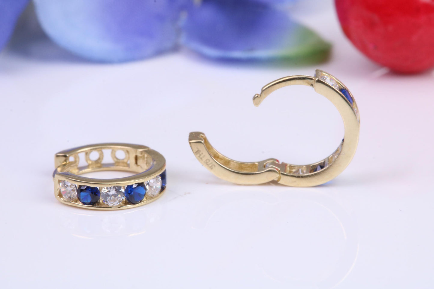 10 mm round hinged hoop earrings, made from solid yellow gold and set with Sapphire and Diamond Cubic Zirconia