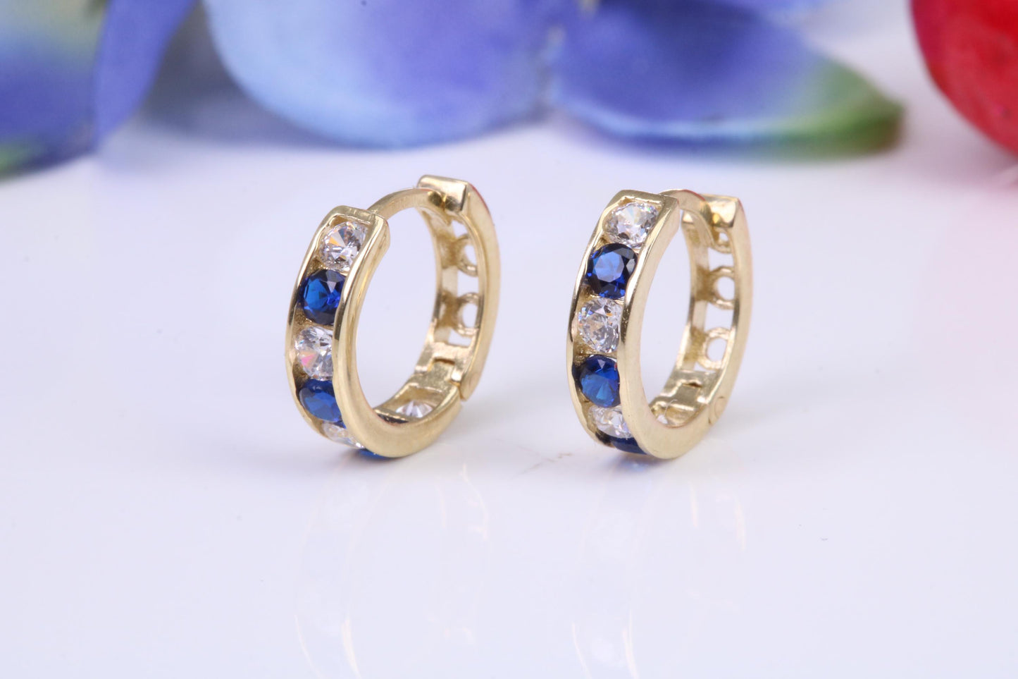 10 mm round hinged hoop earrings, made from solid yellow gold and set with Sapphire and Diamond Cubic Zirconia