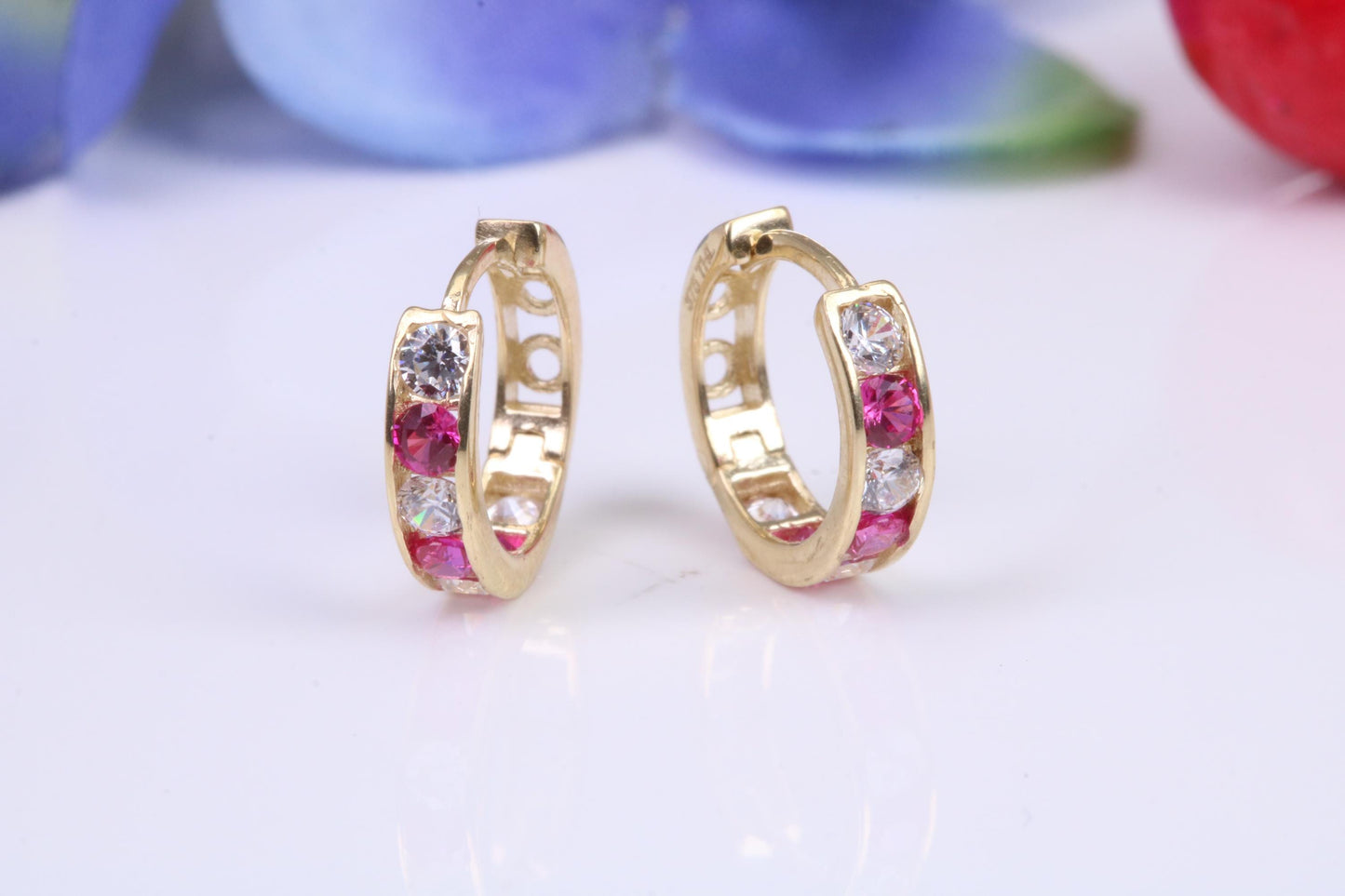 10 mm round hinged hoop earrings, made from solid yellow gold and set with Ruby and Diamond Cubic Zirconia
