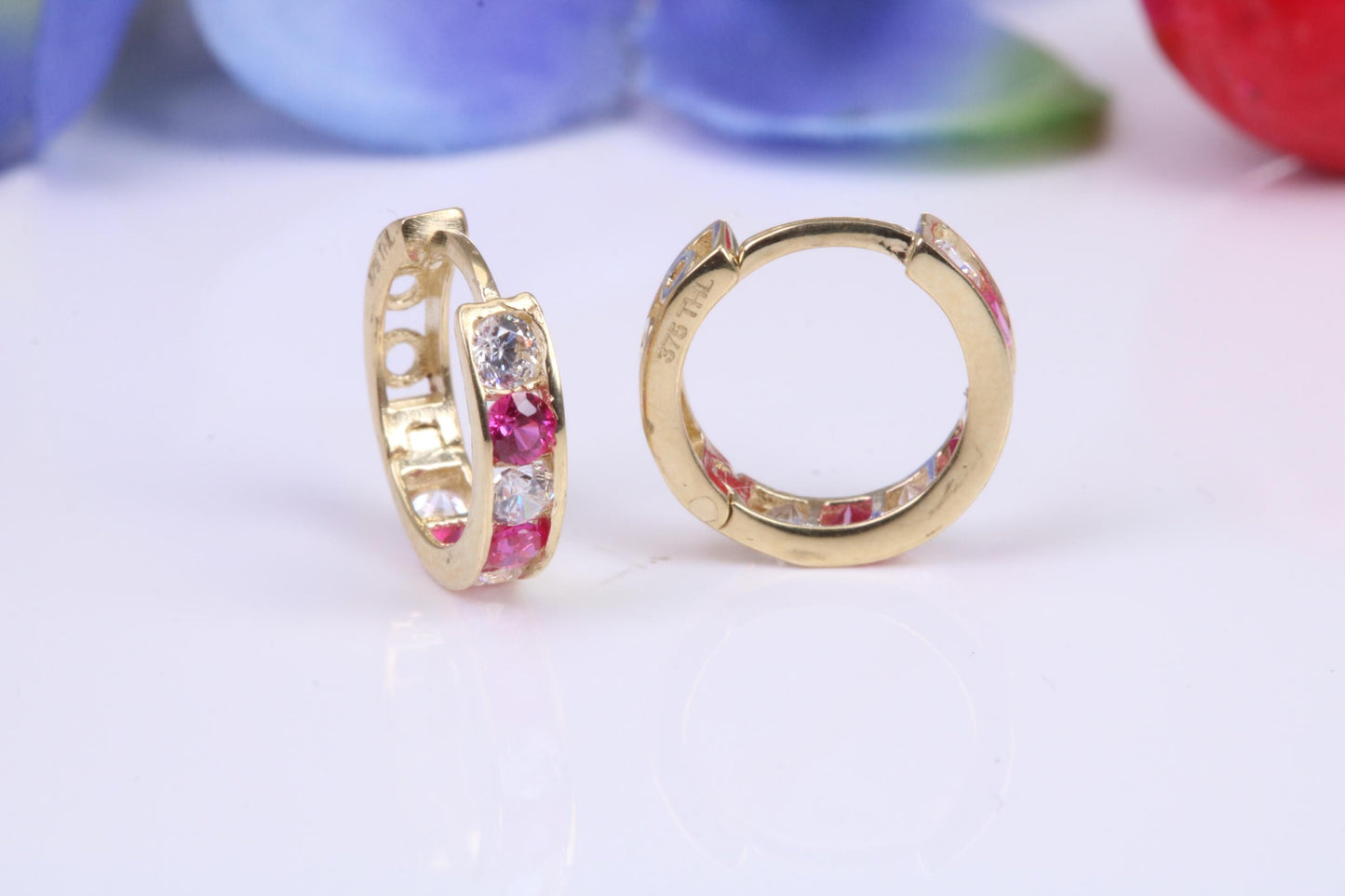 10 mm round hinged hoop earrings, made from solid yellow gold and set with Ruby and Diamond Cubic Zirconia