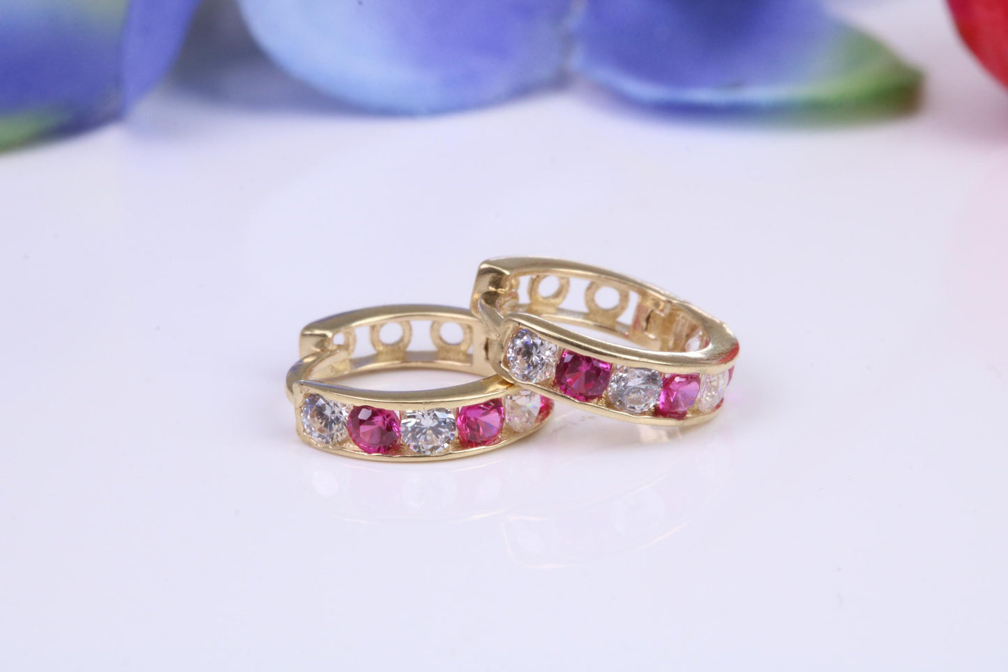 10 mm round hinged hoop earrings, made from solid yellow gold and set with Ruby and Diamond Cubic Zirconia