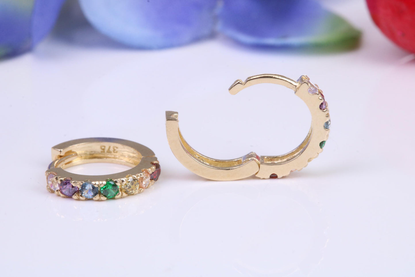10 mm round hinged hoop earrings, made from solid yellow gold and set with Rainbow Coloured Cubic Zirconia