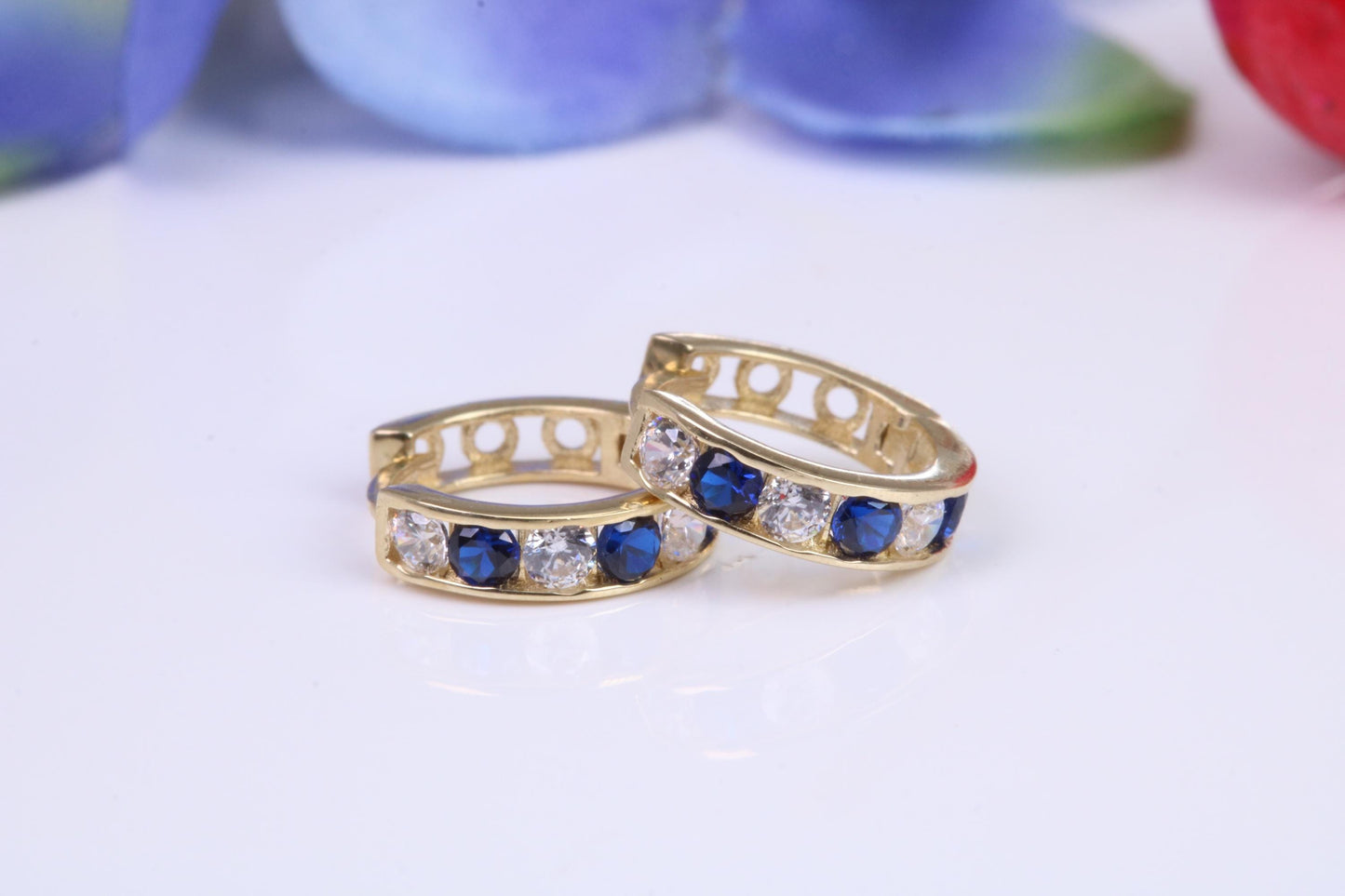 10 mm round hinged hoop earrings, made from solid yellow gold and set with Sapphire and Diamond Cubic Zirconia
