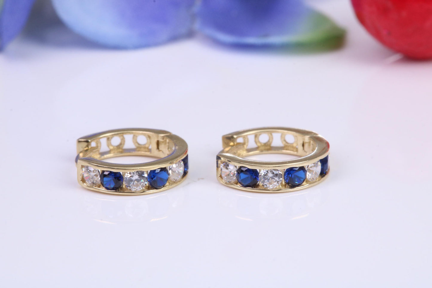 10 mm round hinged hoop earrings, made from solid yellow gold and set with Sapphire and Diamond Cubic Zirconia