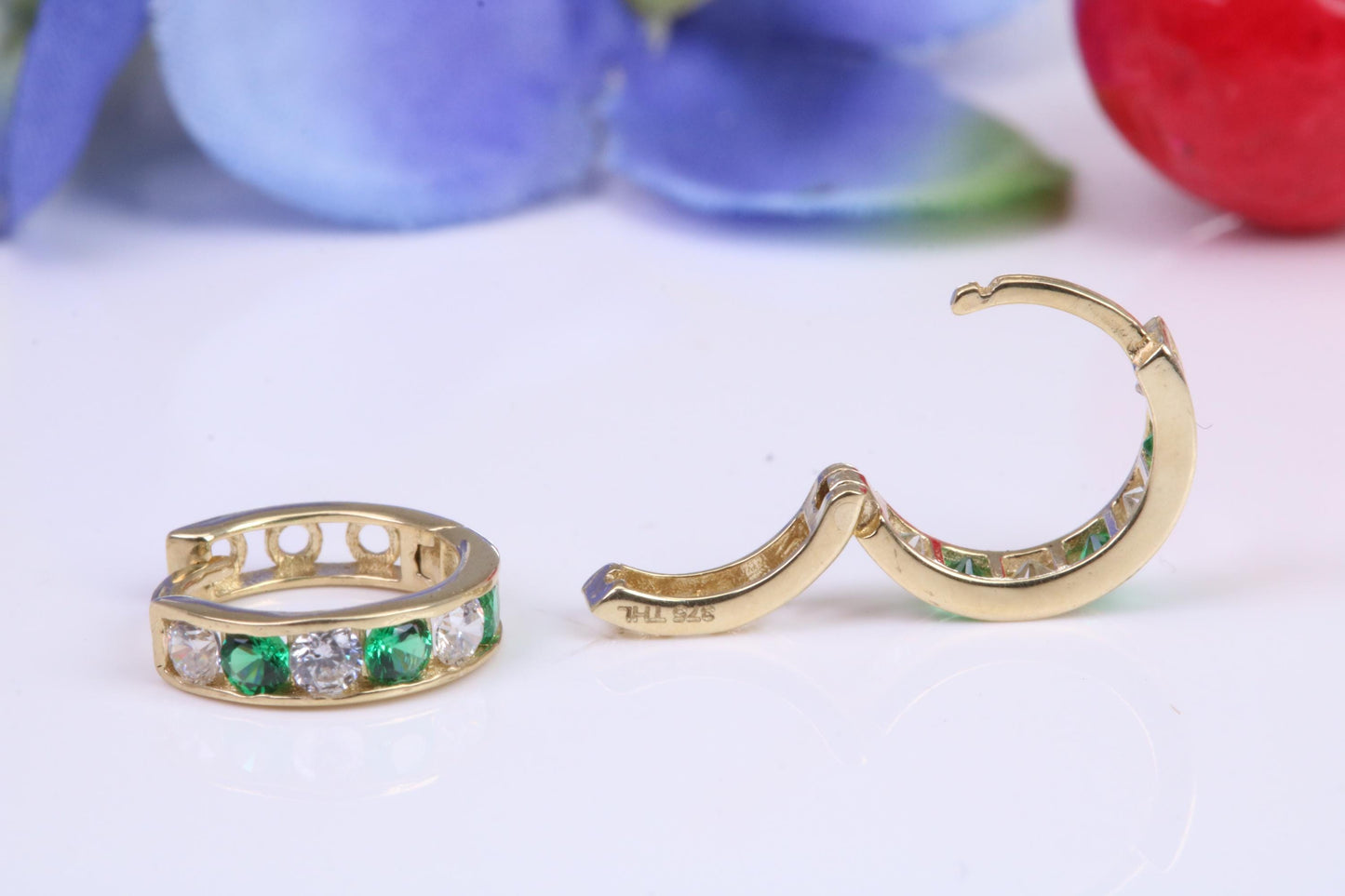 10 mm round hinged hoop earrings, made from solid yellow gold and set with Emerald and Diamond Cubic Zirconia