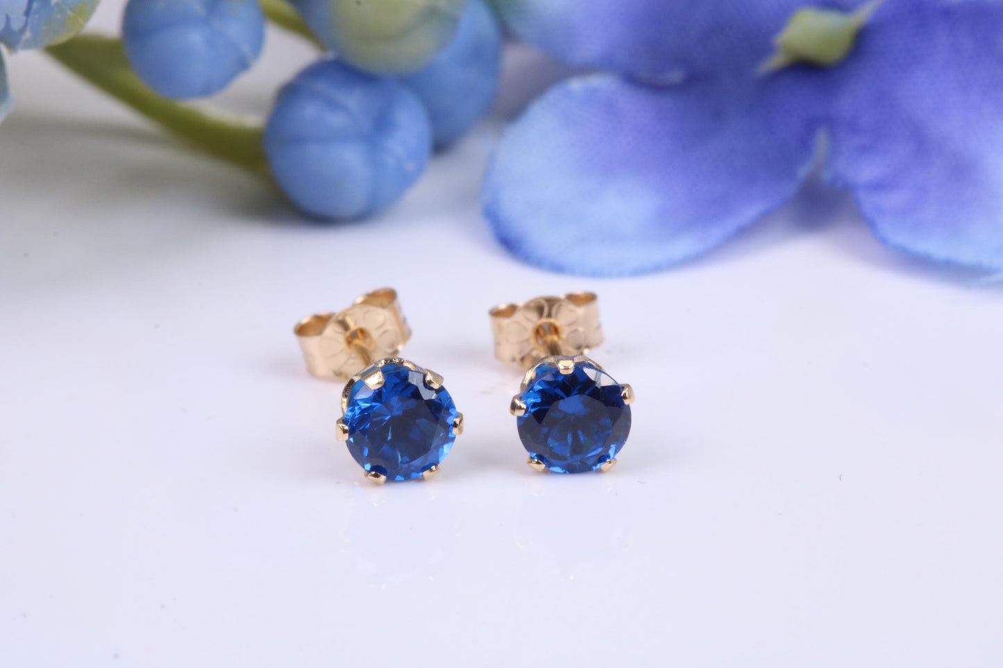 Small 4 mm Round Sapphire Blue Cubic Zirconia set Stud Earrings, Made from Solid 9ct Yellow Gold
