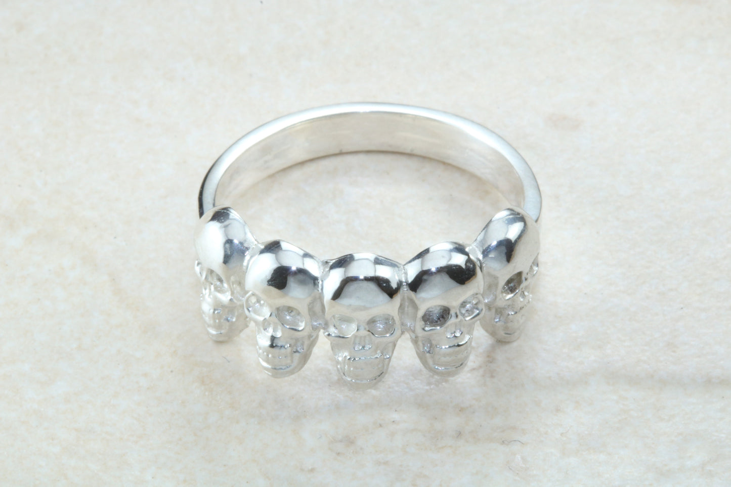 Skull ring,solid silver, 5 skulls around ring, perfect for ladies and gents. Available in Silver, Yellow gold, White gold and Platinum