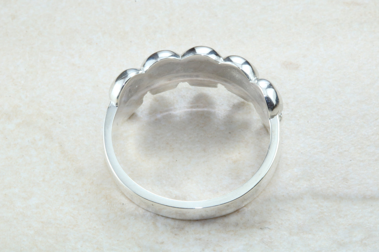 Skull ring,solid silver, 5 skulls around ring, perfect for ladies and gents. Available in Silver, Yellow gold, White gold and Platinum
