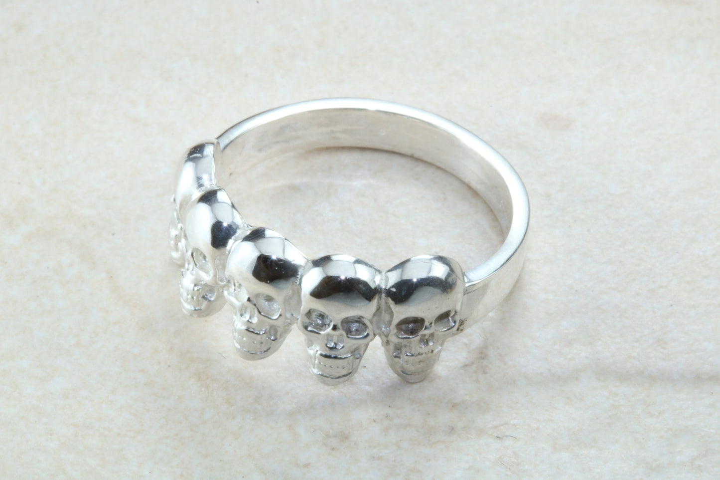 Skull ring,solid silver, 5 skulls around ring, perfect for ladies and gents. Available in Silver, Yellow gold, White gold and Platinum