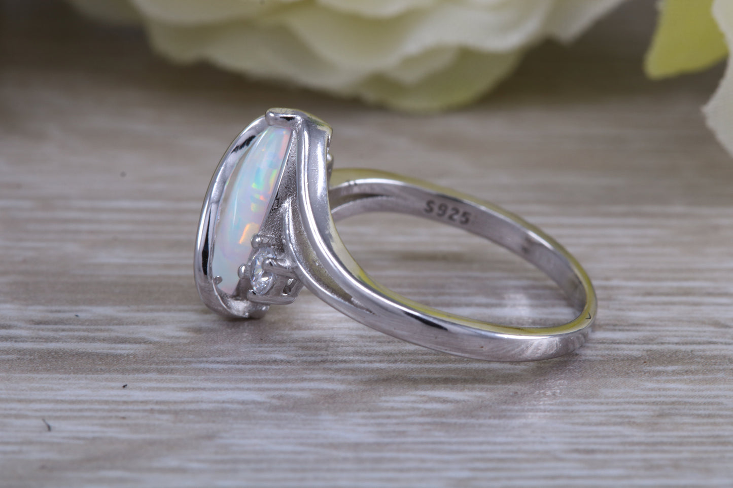 Very sparkly and fiery Opal and cubic zirconia set dress ring, solid sterling silver ring further rhodium plated for that platinum look