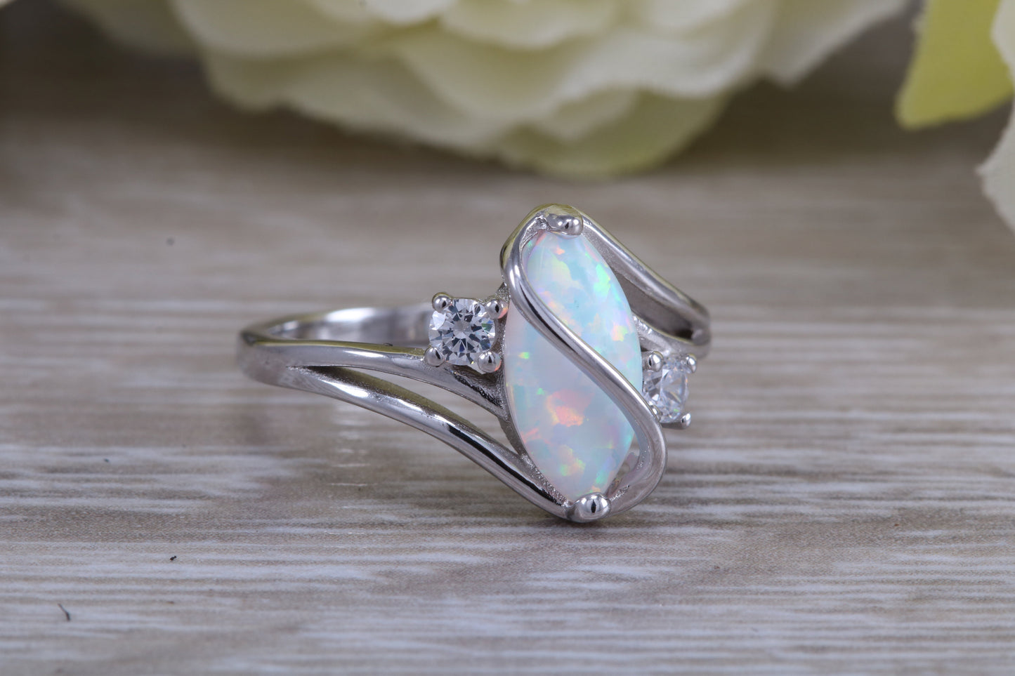 Very sparkly and fiery Opal and cubic zirconia set dress ring, solid sterling silver ring further rhodium plated for that platinum look