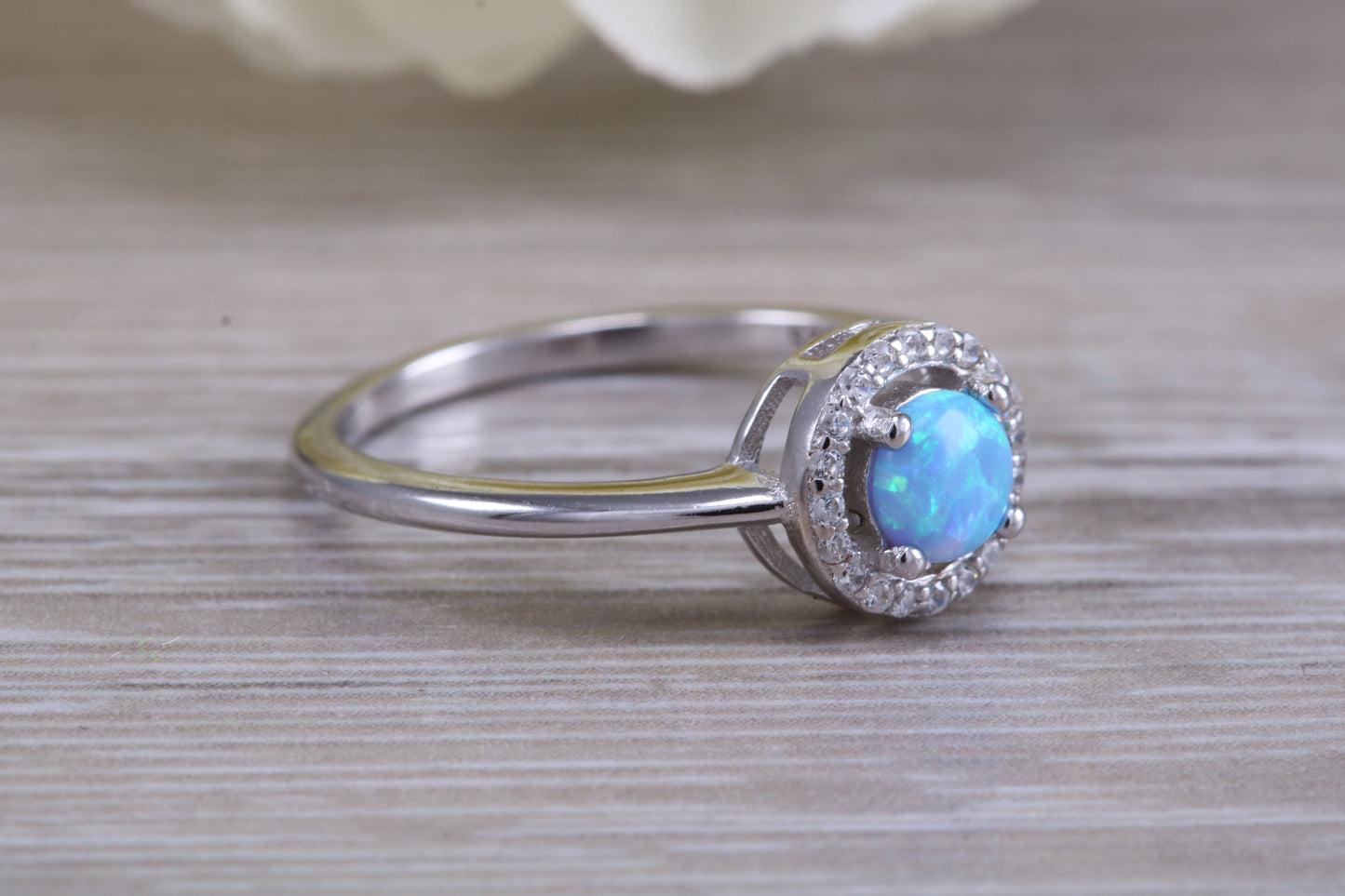 Very sparkly and fiery Opal and cubic zirconia set halo ring, solid sterling silver ring further rhodium plated for that platinum look