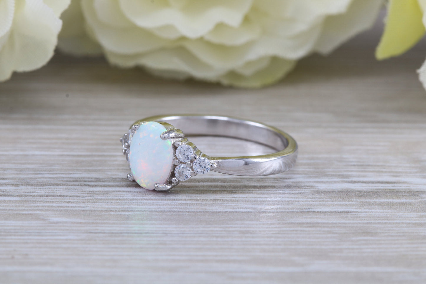 Very sparkly and fiery Opal and cubic zirconia set dress ring, solid sterling silver ring further rhodium plated for that platinum look