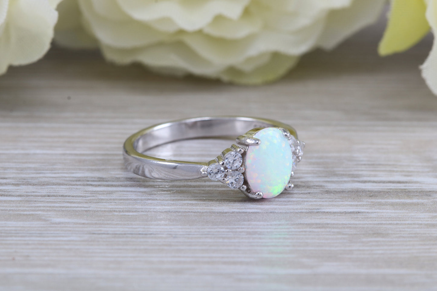 Very sparkly and fiery Opal and cubic zirconia set dress ring, solid sterling silver ring further rhodium plated for that platinum look
