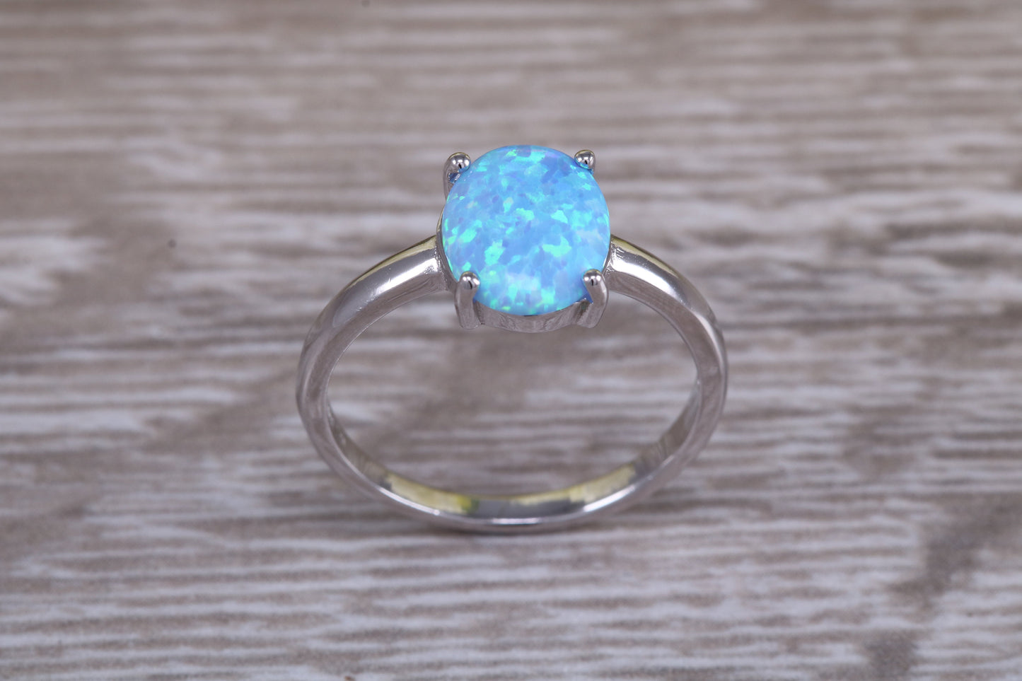 Very sparkly and fiery Opal solitaire, solid sterling silver ring further rhodium plated for that platinum look