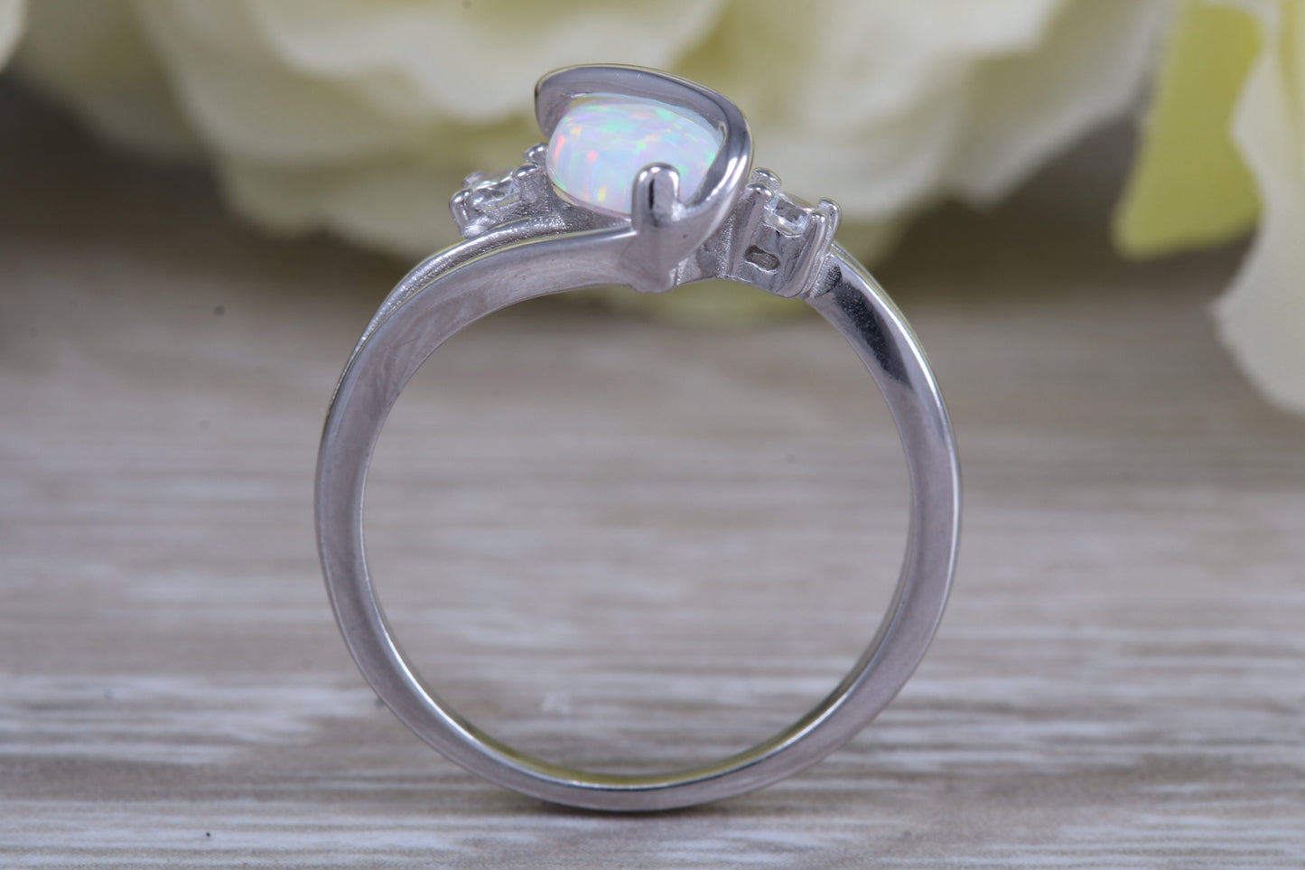 Very sparkly and fiery Opal and cubic zirconia set dress ring, solid sterling silver ring further rhodium plated for that platinum look