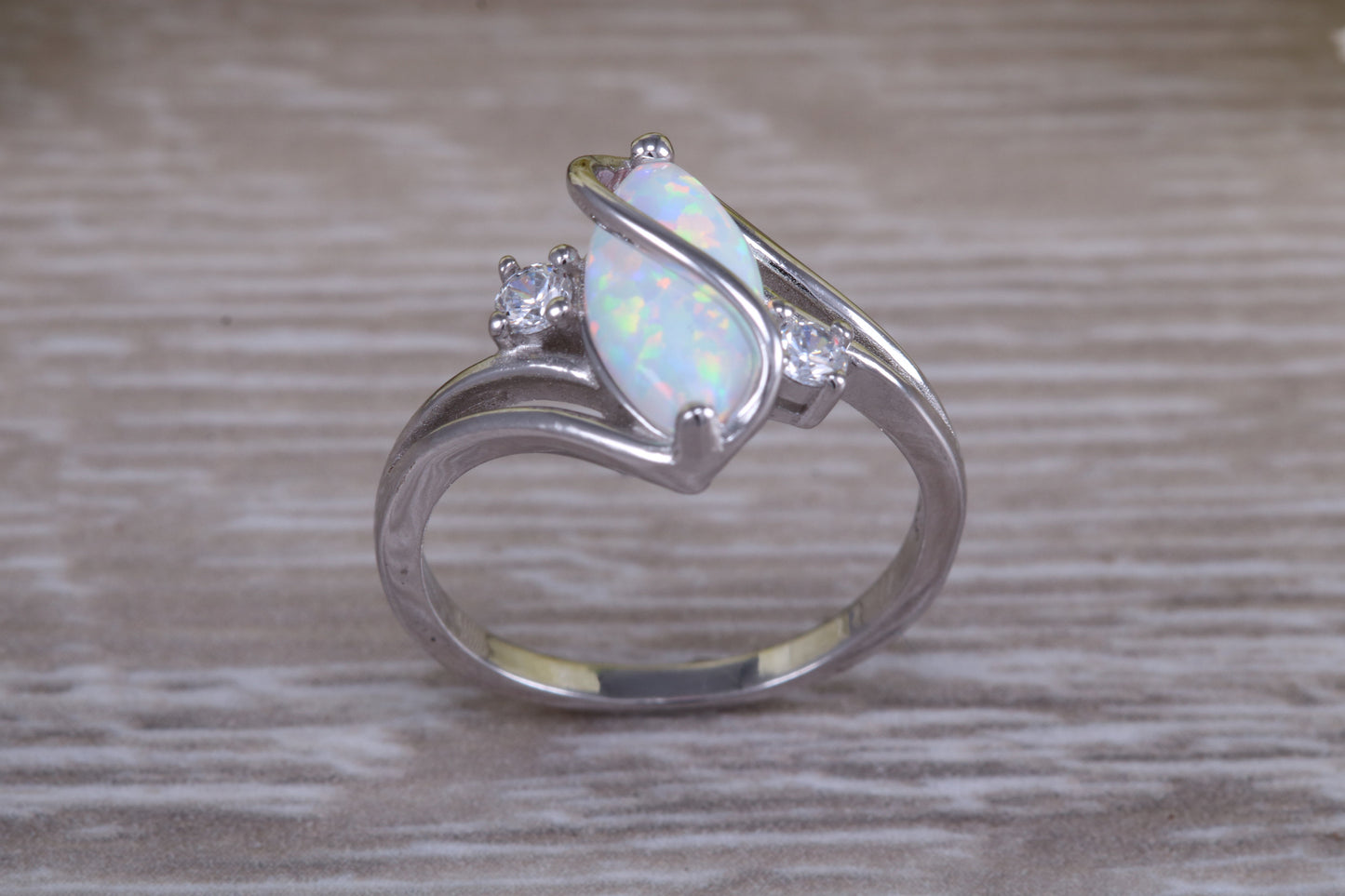 Very sparkly and fiery Opal and cubic zirconia set dress ring, solid sterling silver ring further rhodium plated for that platinum look
