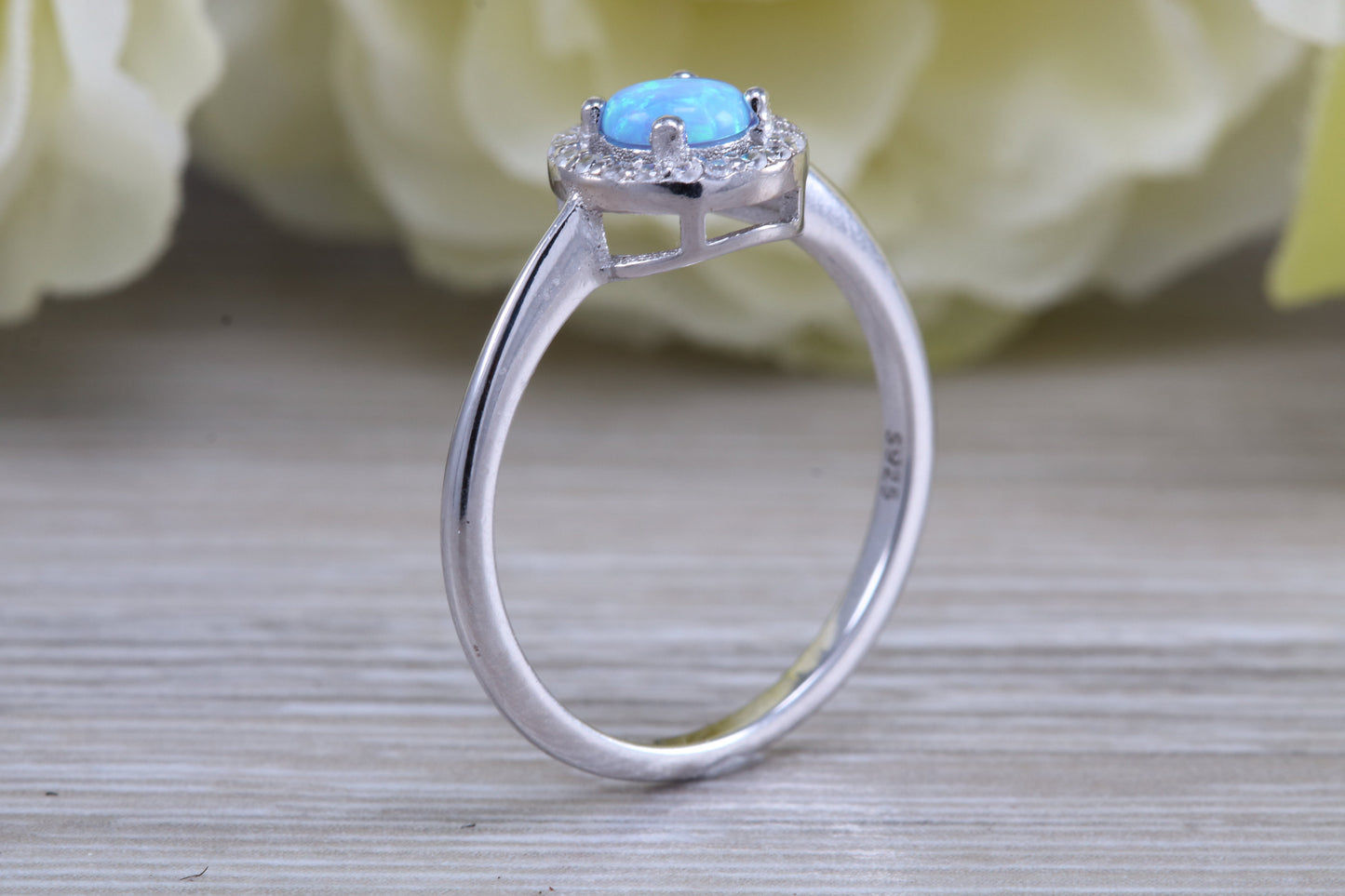 Very sparkly and fiery Opal and cubic zirconia set halo ring, solid sterling silver ring further rhodium plated for that platinum look