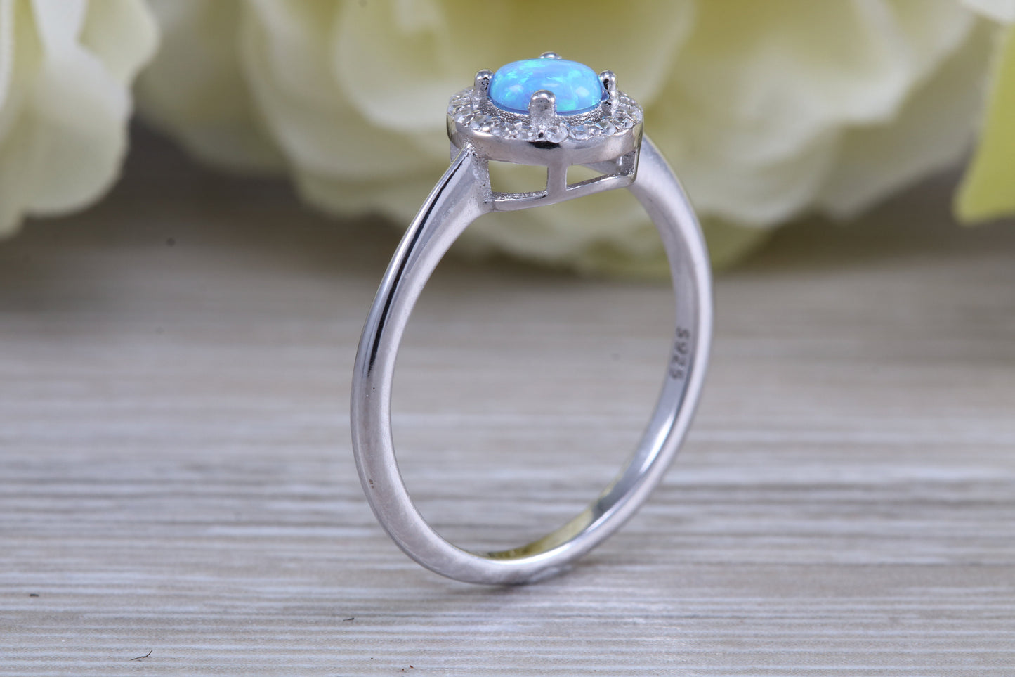 Very sparkly and fiery Opal and cubic zirconia set halo ring, solid sterling silver ring further rhodium plated for that platinum look