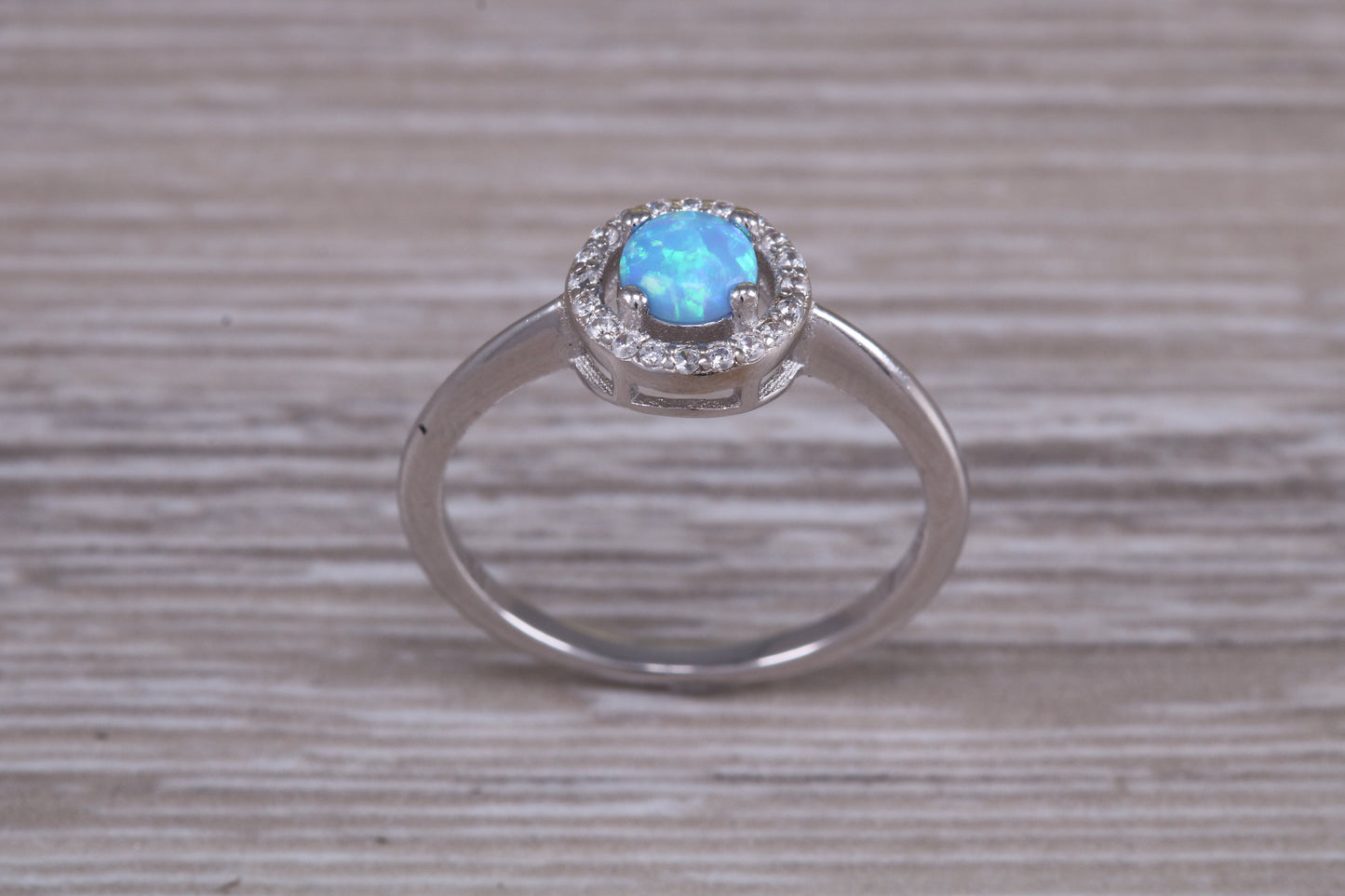 Very sparkly and fiery Opal and cubic zirconia set halo ring, solid sterling silver ring further rhodium plated for that platinum look
