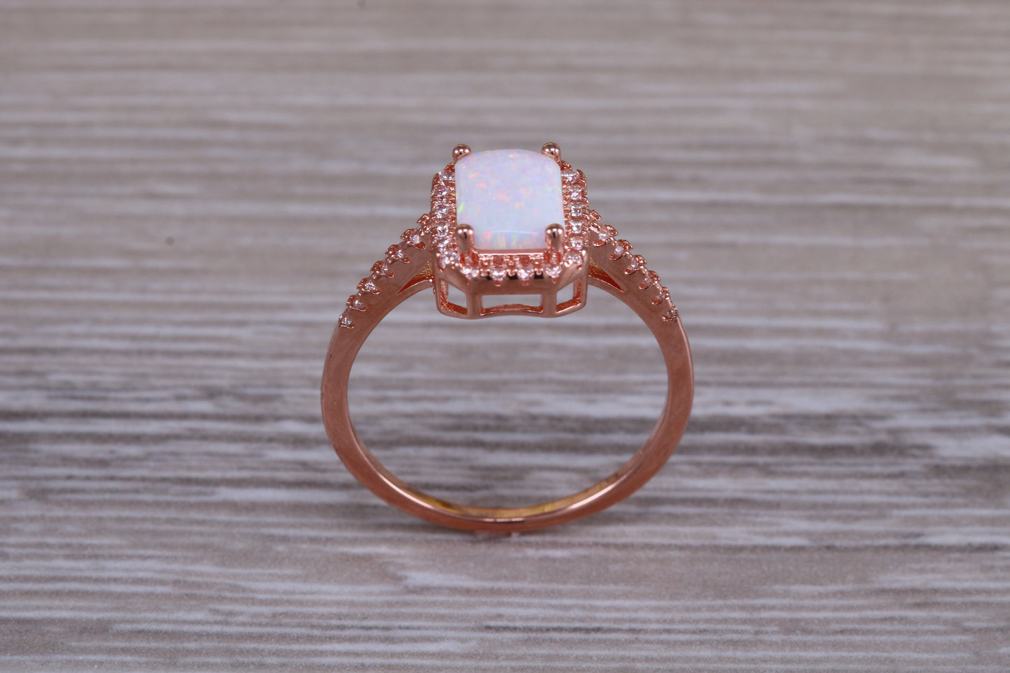 Very sparkly and fiery Opal and cubic zirconia set dress ring, solid sterling silver ring further 18ct rose gold plated
