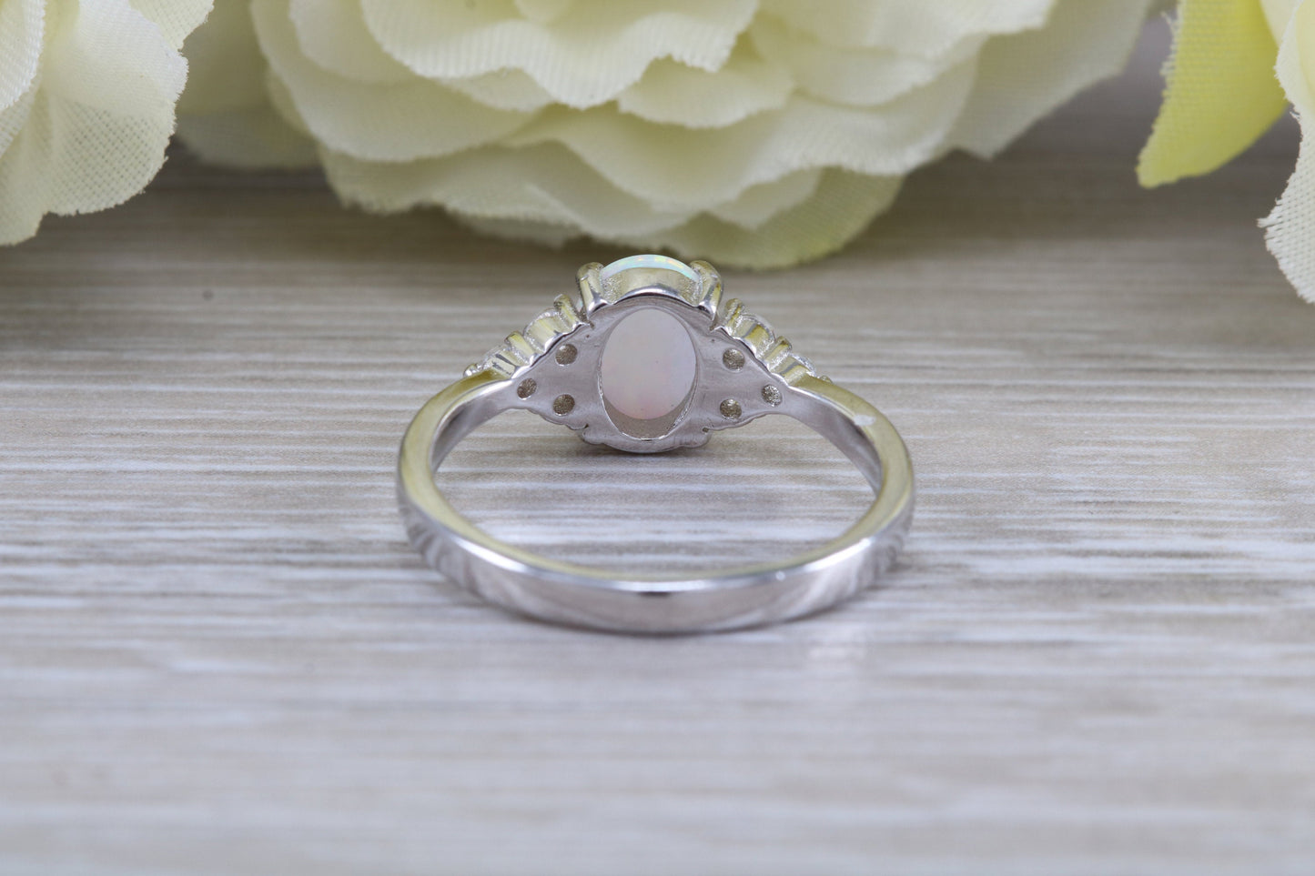 Very sparkly and fiery Opal and cubic zirconia set dress ring, solid sterling silver ring further rhodium plated for that platinum look